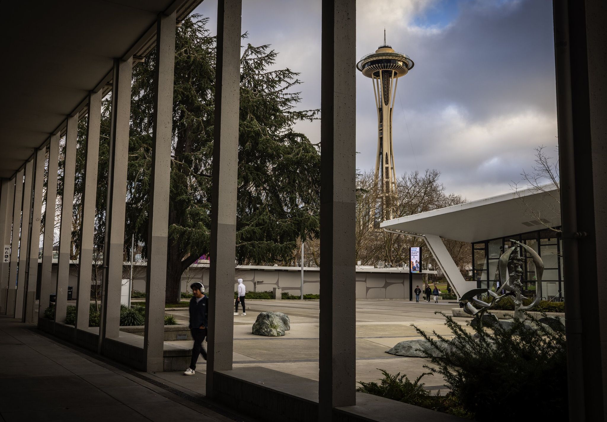 The Space Needle at Seattle Center is seen through aging buildings, including a pavilion, in background, which once held exhibits for the 1962 World’s Fair. Plans for a bond measure to revamp facilities on Seattle Center’s campus have new backers in City Hall. (Ken Lambert / The Seattle Times)