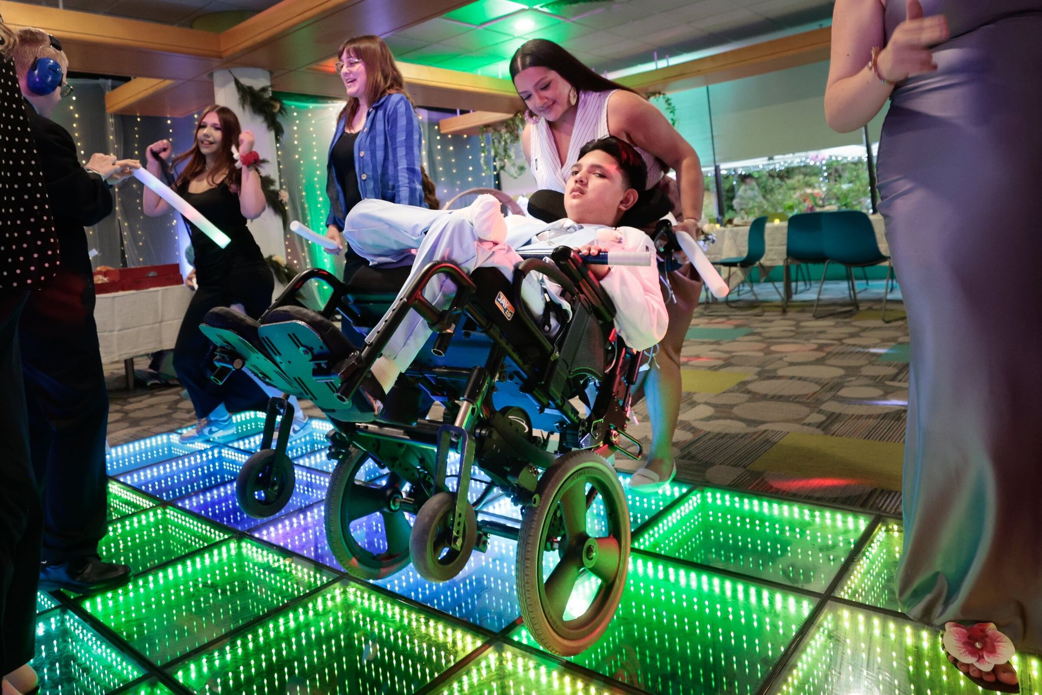 Elizabeth Torres dances with her son Manny. (Karen Ducey / The Seattle Times)