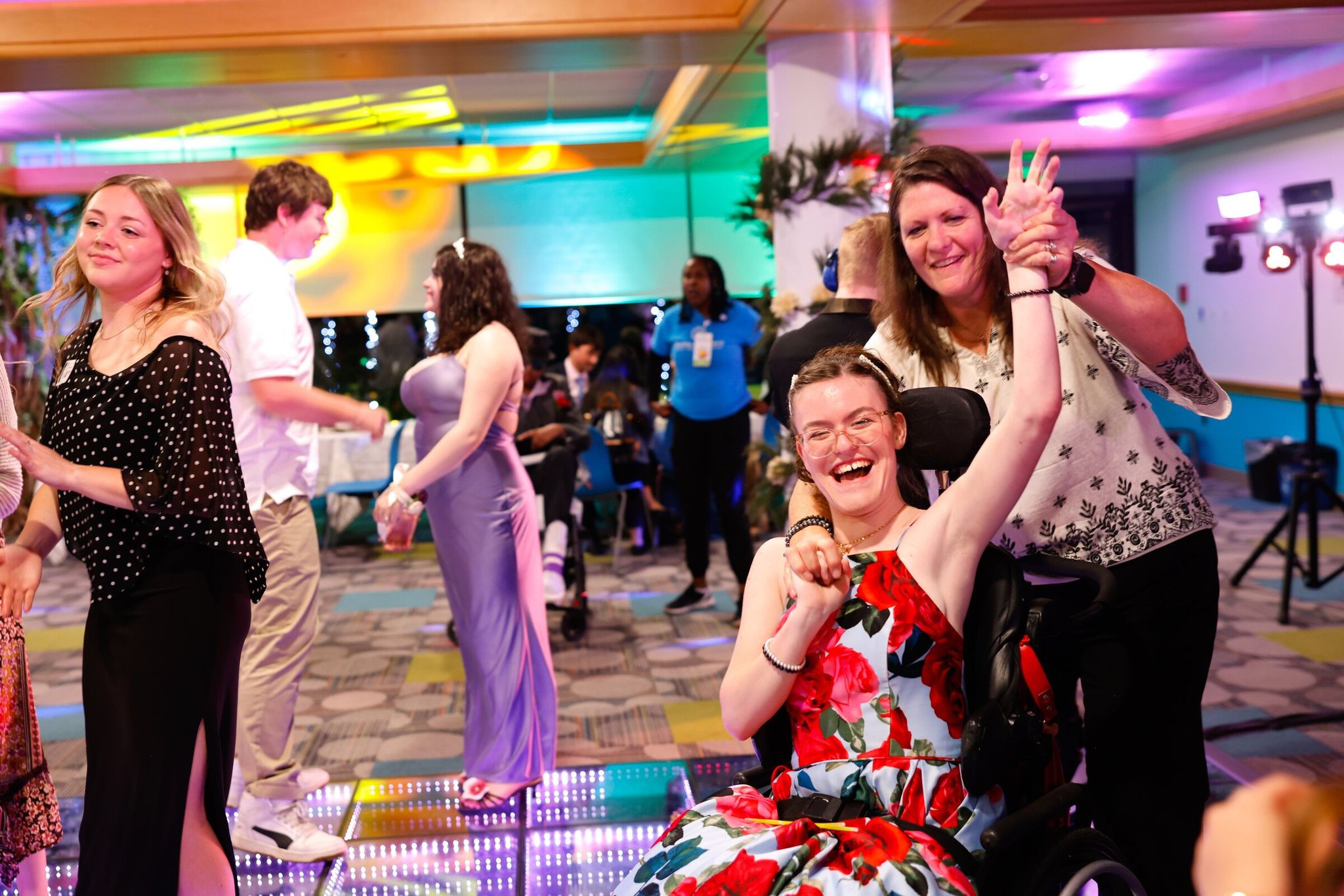 Summer Cameron (center) and her mother, Melanie Cameron of Renton, light up the dance floor. (Karen Ducey / The Seattle Times)