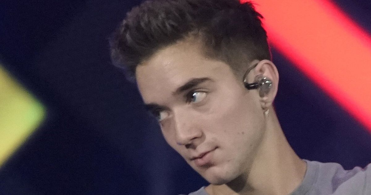 Ex-girlfriend of boy band member charged with trying to hire a hitman to kill him