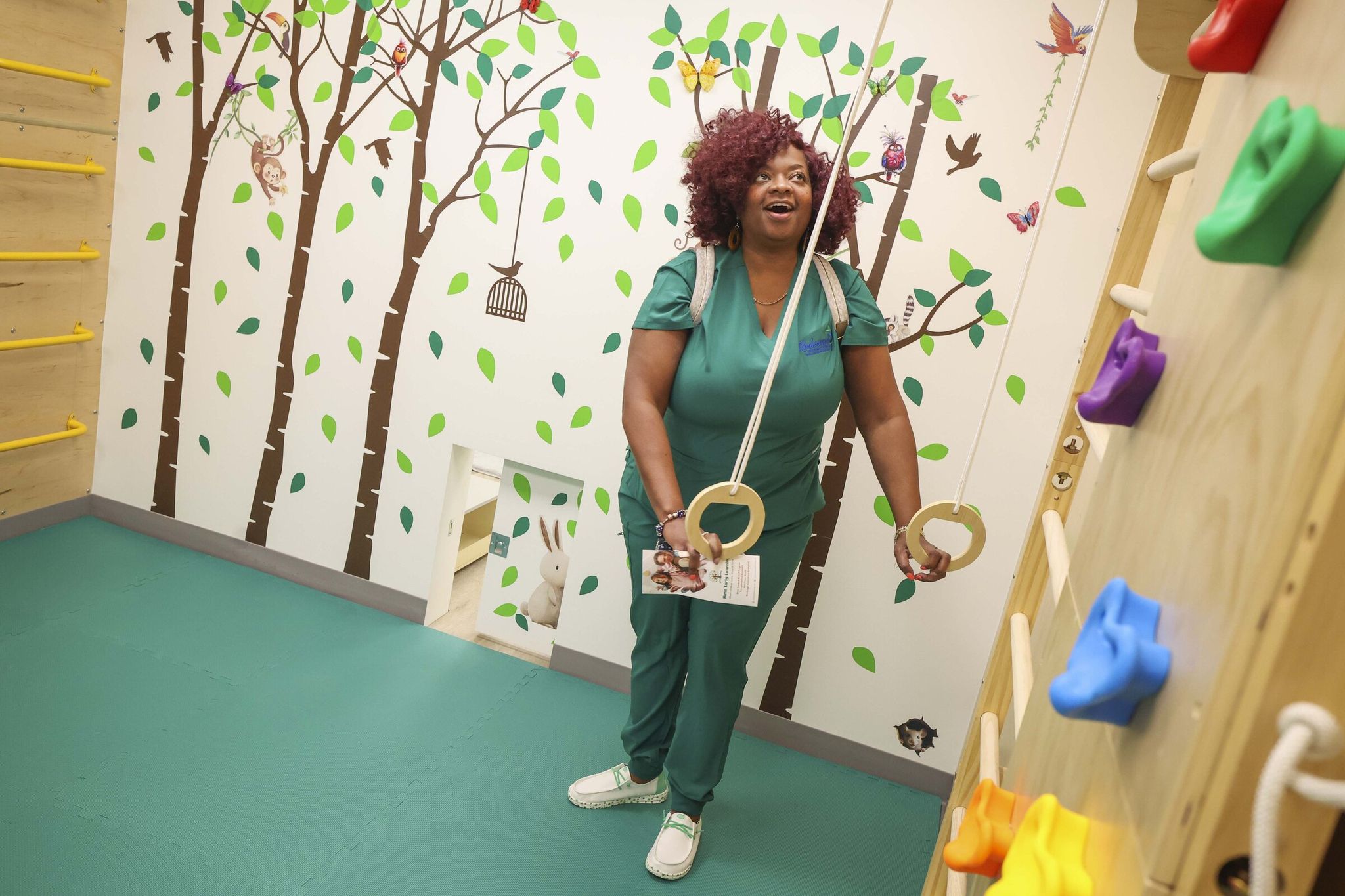 Dr. Jacquelin Bolss of Redeemed Wellness Center reacts to an active sensory playroom during the grand opening of the Voices of Tomorrow Center for Learning and Healing. “I create these types of spaces in early learning, so when I see this I get chills because it’s needed,” Bolss said. “Our children deserve this.” (Ivy Ceballo / The Seattle Times)