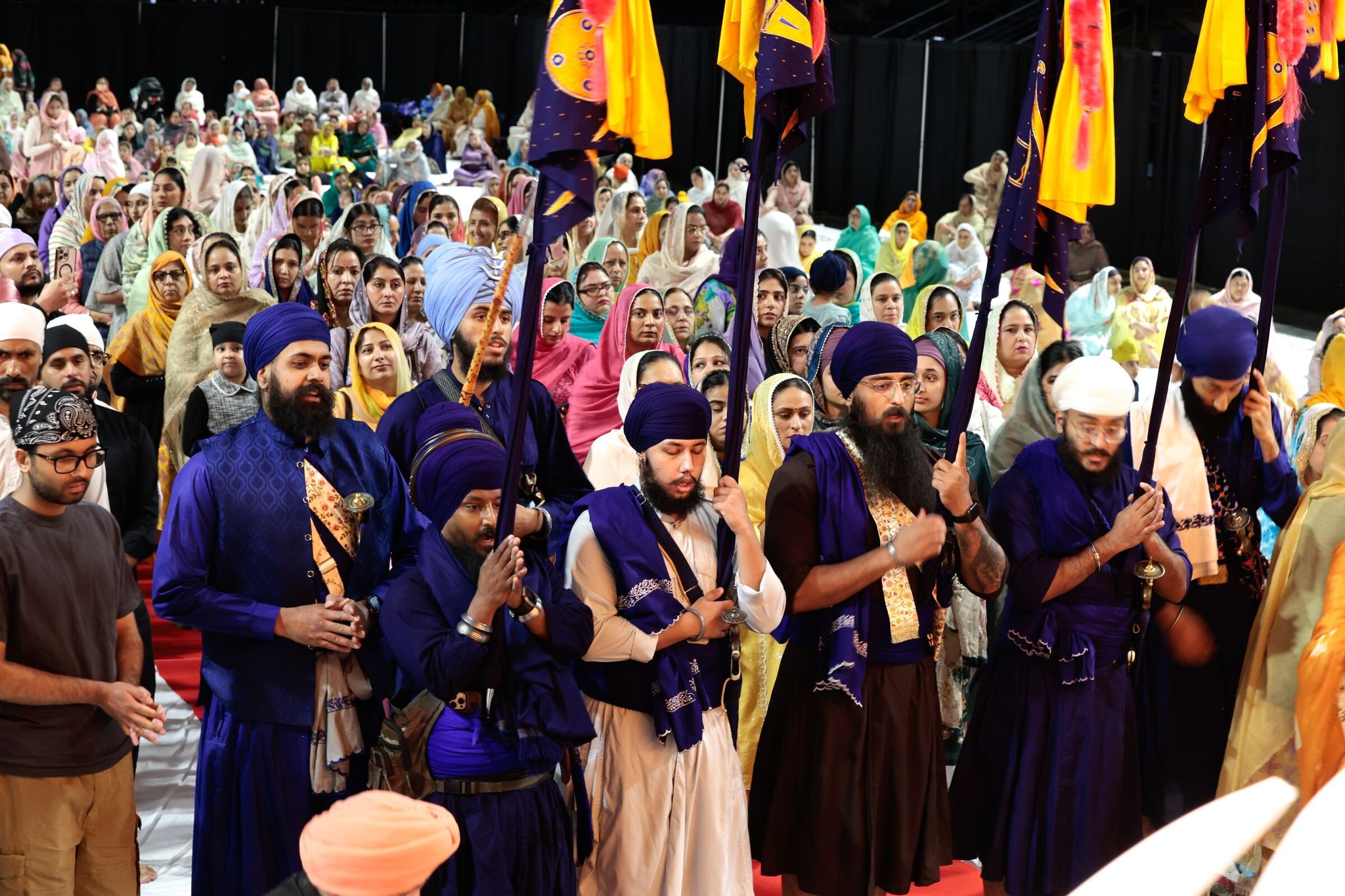 Worshippers take part in Sikh Day, also known as Vaisakhi Day, the annual religious and cultural event organized by the Singh Sabha Gurdwara of Renton, at the ShoWare Center in Kent on Saturday. (Karen Ducey / The Seattle Times)