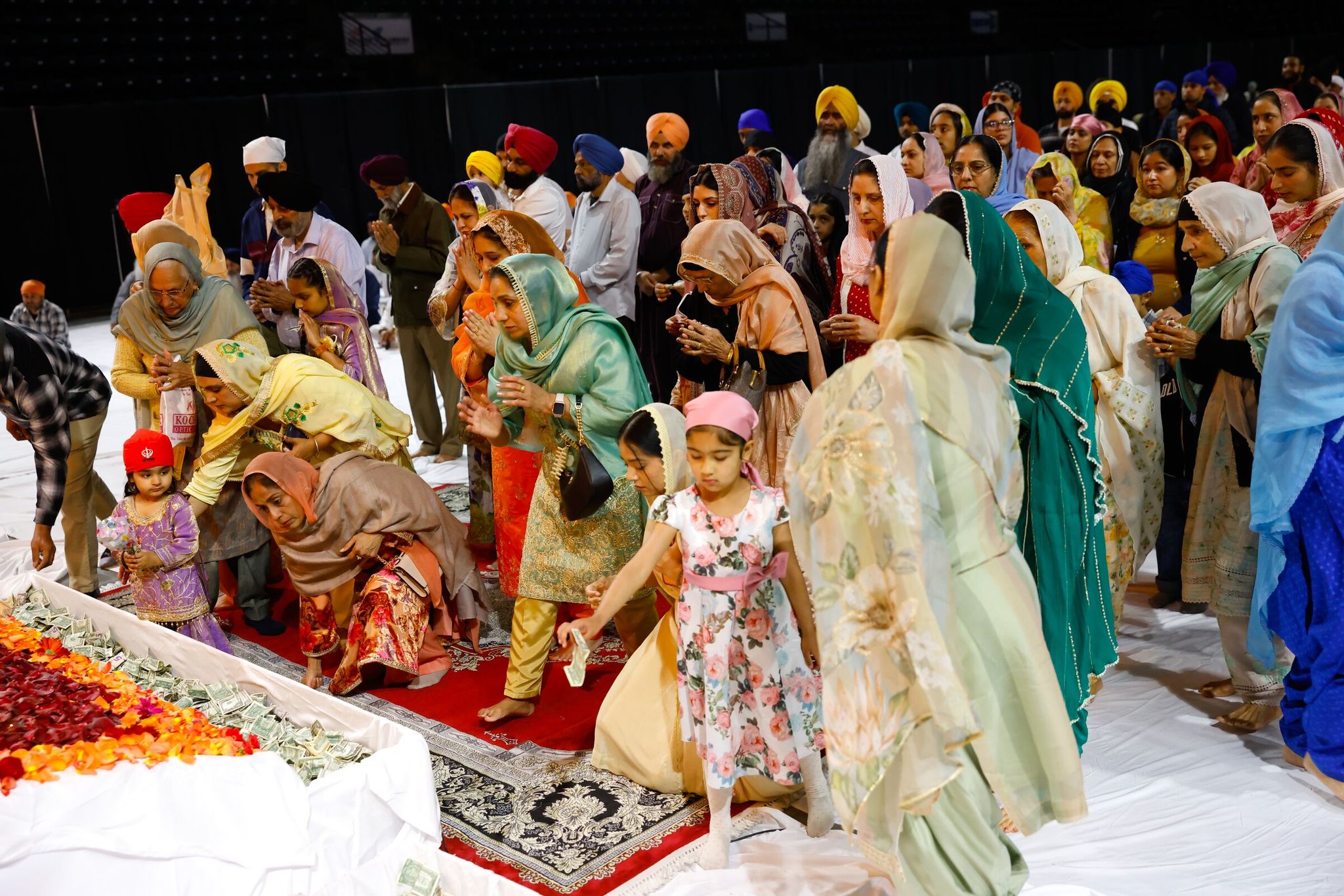 Worshippers participate in Vaisakhi, also known as Sikh Day, an annual religious and cultural event organized by Gurdwara Singh Sabha of Renton, at the ShoWare Center in Kent on Saturday. (Karen Ducey / The Seattle Times)