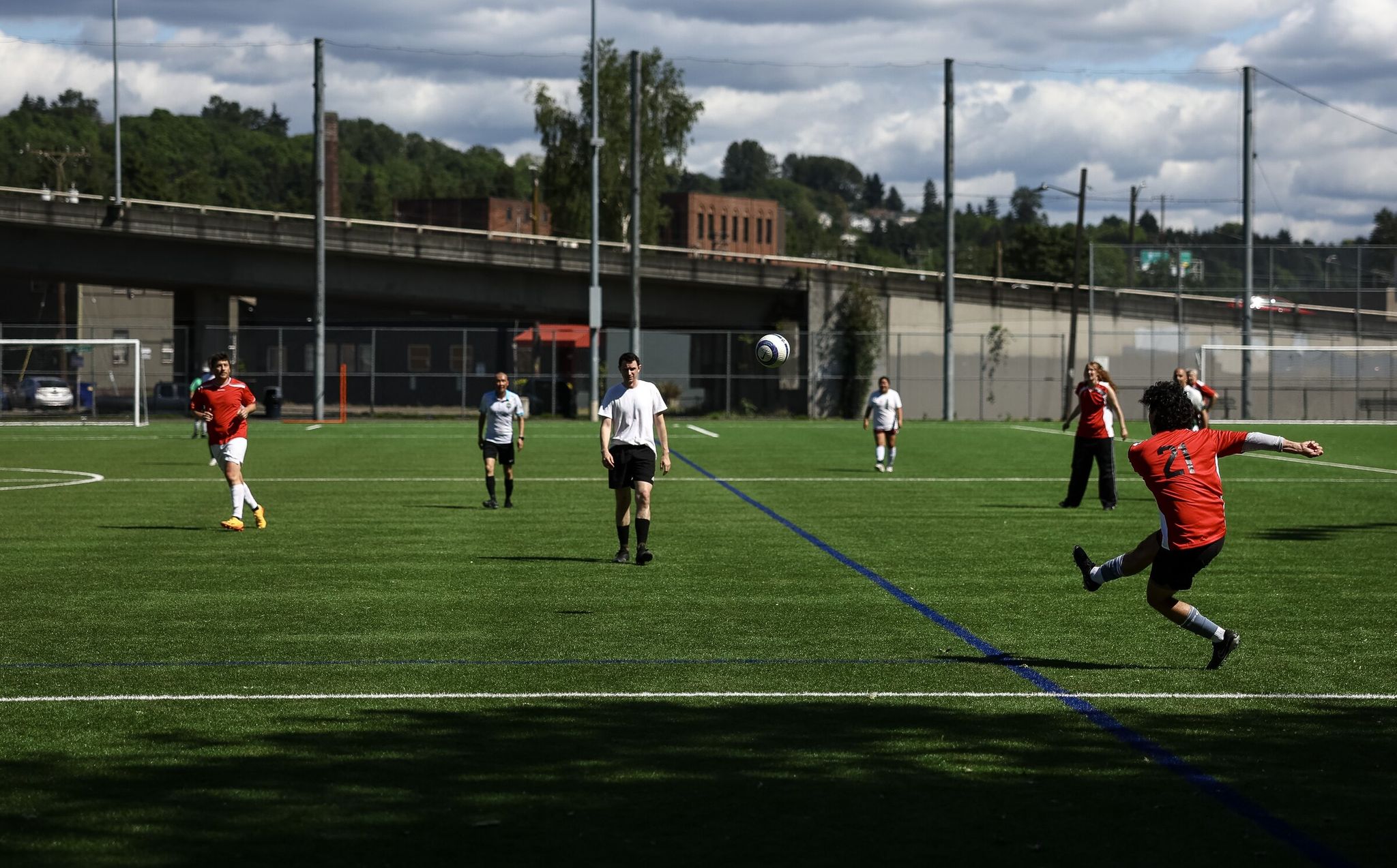 Recreational soccer players play during a match at Georgetown Playfield. (Nick Wagner / The Seattle Times)