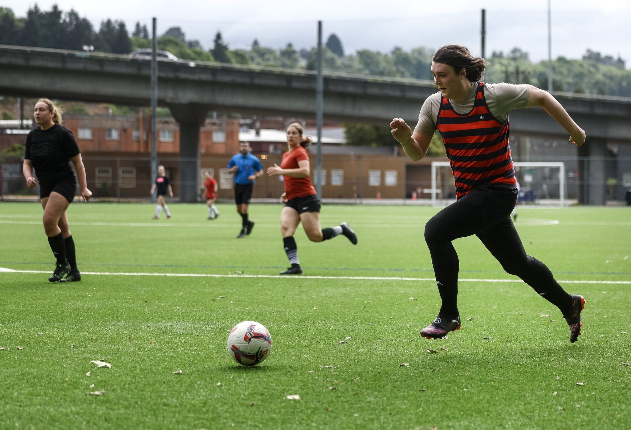 The quickens head toward the goal during a Recreational Adult Team match at Georgetown Playfield on Sunday, May 17, in Seattle. (Nick Wagner / The Seattle Times)