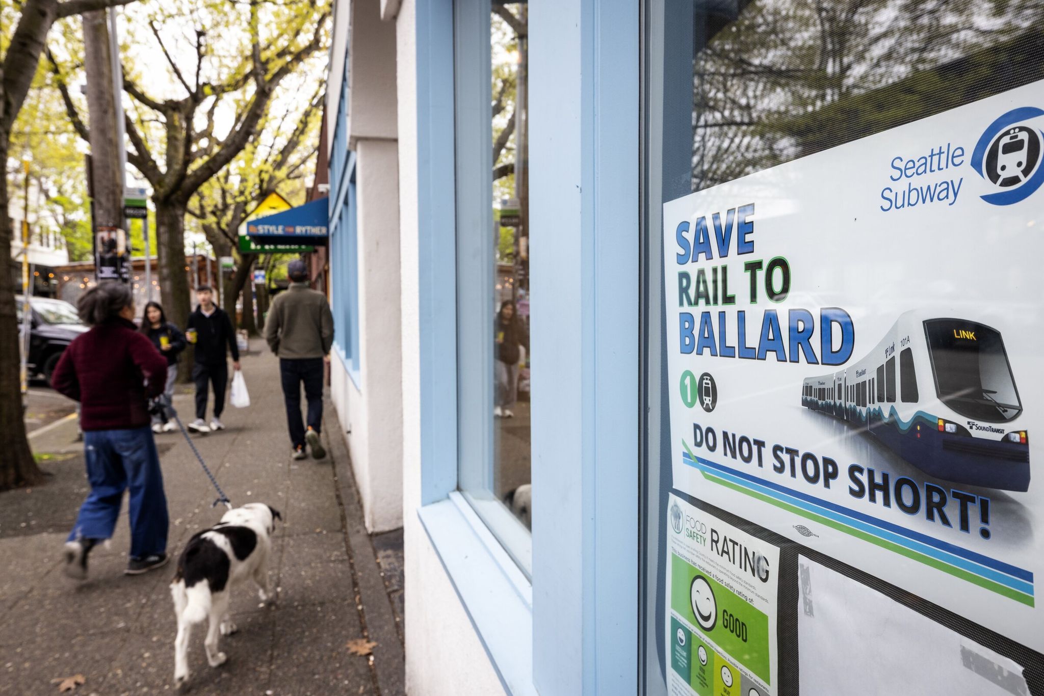 Posters like this one supporting light-rail expansion appeared in shop windows in central Ballard. (Ken Lambert / The Seattle Times)