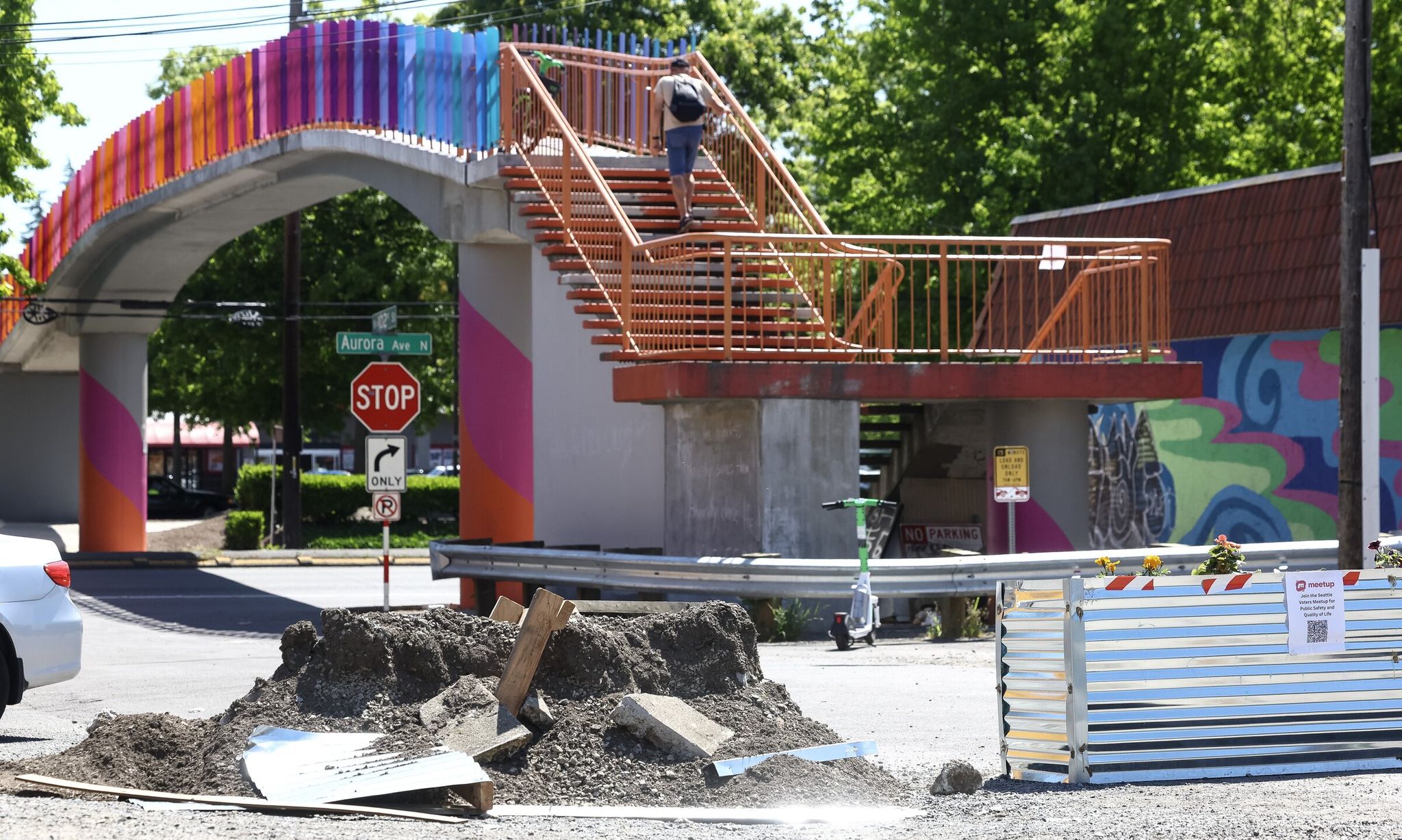 A barricade installed by community members was demolished while another remained on North 102nd Street near Aurora Avenue in Seattle on Thursday. (Nick Wagner / The Seattle Times)