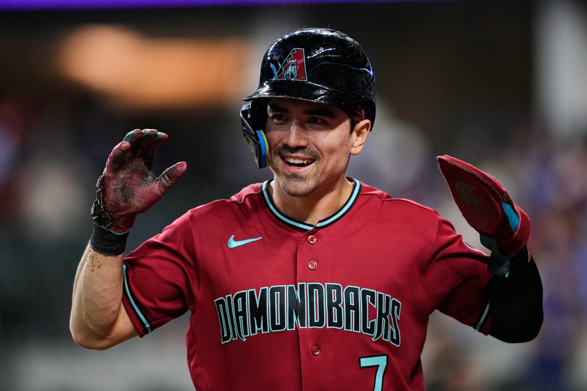 Arizona Diamondbacks player and Seattle native Corbin Carroll celebrates after scoring on Geraldo Perdomo’s double against the Texas Rangers, May 11, 2026, in Arlington, Texas. (Tony Gutierrez / AP)