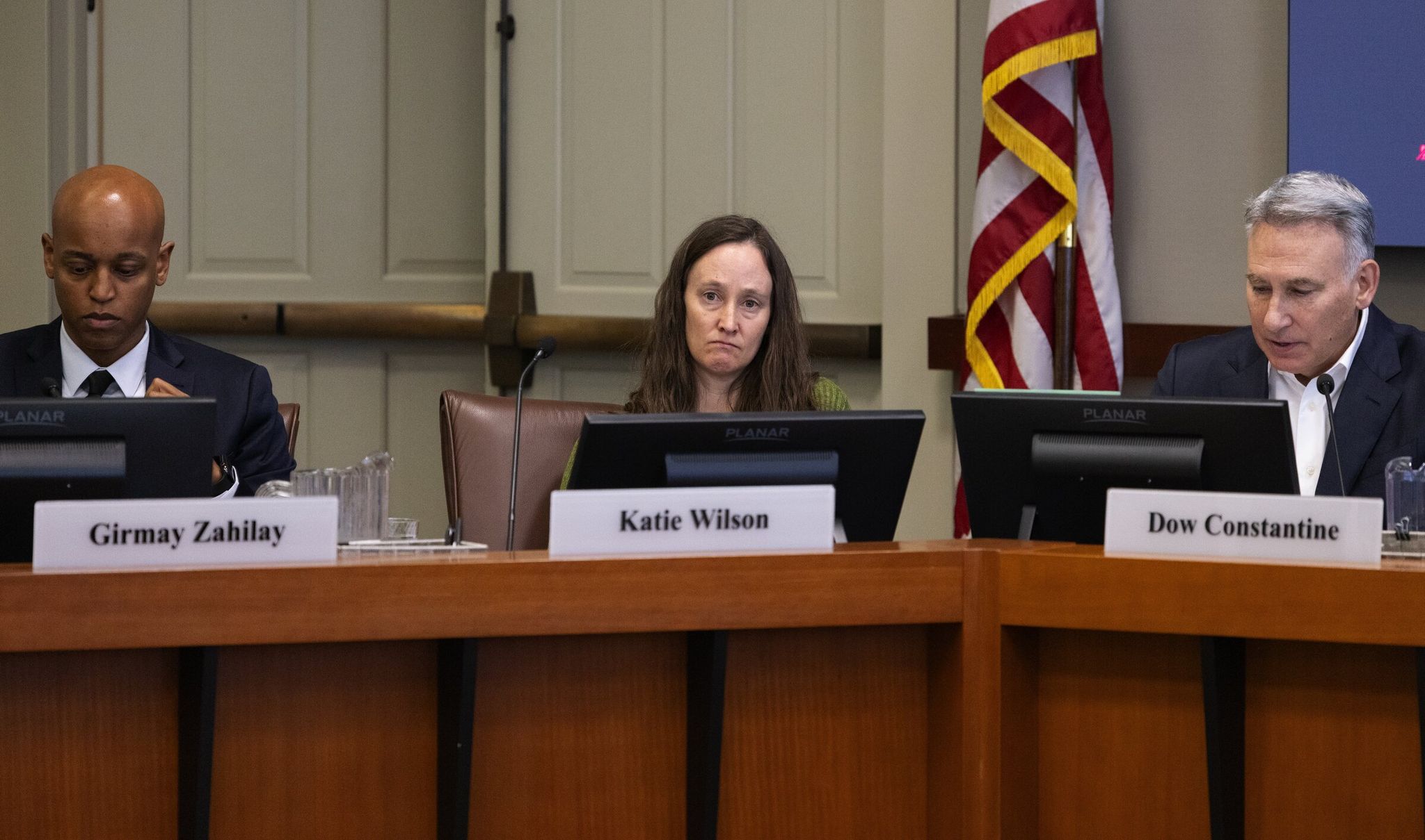 Sound Transit board members, left to right: King County Executive Girmay Zahilay, Seattle Mayor Jenny Durkan and Sound Transit CEO Doug Constantine, before voting on the Sound Transit alignment regarding future stations on Thursday, May 28, 2026, in Seattle. (Ken Lambert / The Seattle Times)
