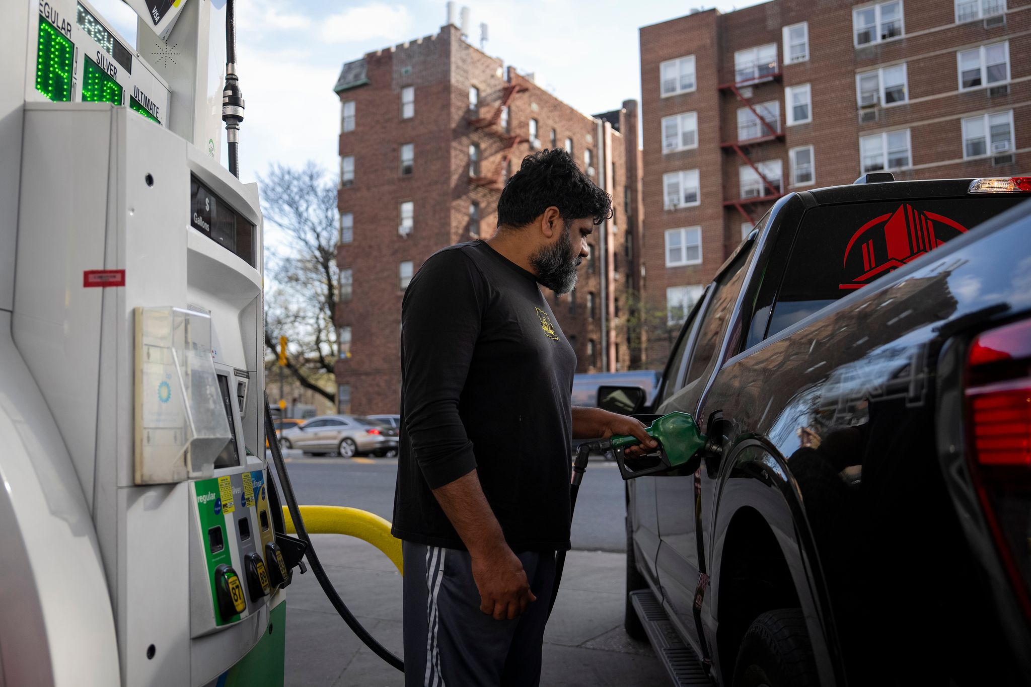 A driver fills his truck with gas at a gas station in Brooklyn on April 16. The price of gasoline has gone up around 50 percent in the United States since the war in Iran began, but that average can mask big differences across the country. (Vincent Alban/The New York Times)