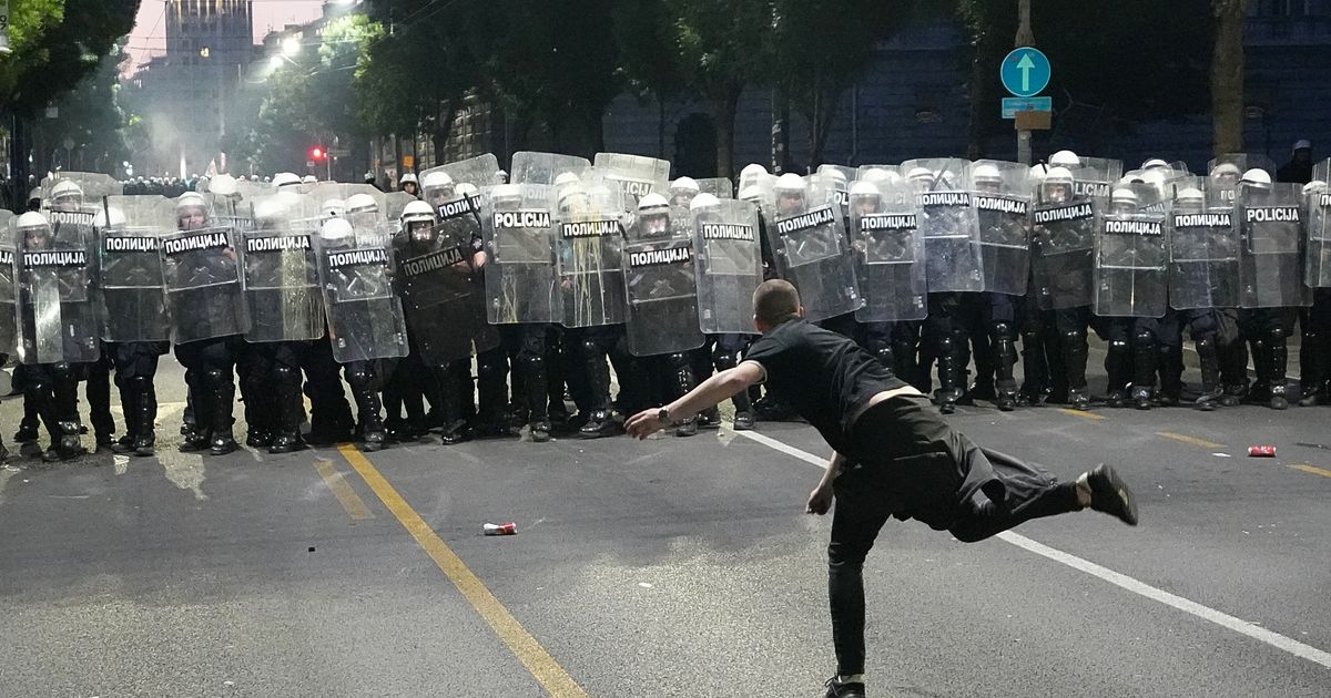 Protesters clash with police after an anti-government rally in Serbia’s capital