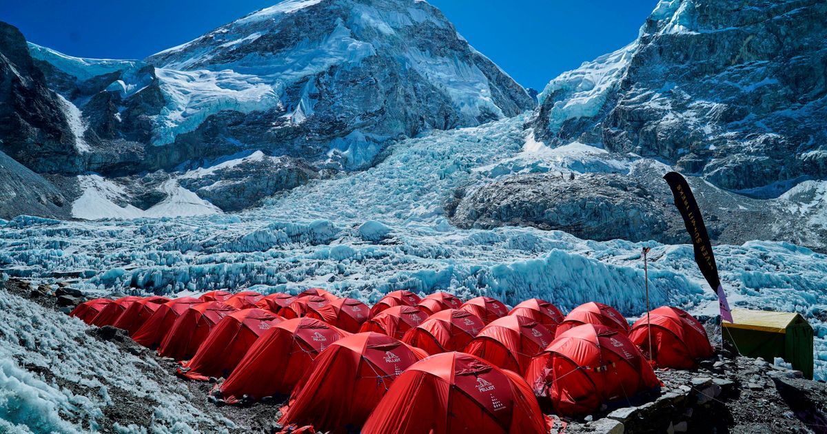 Mount Everest season opens late, with climbers undeterred by huge ice block and high travel costs