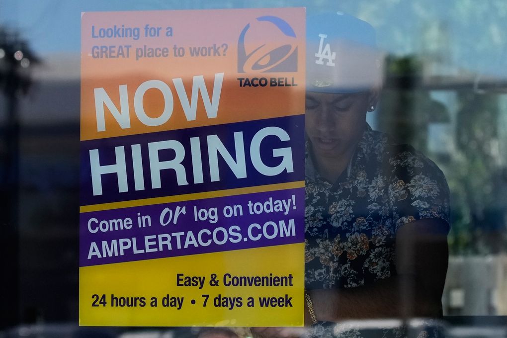 US jobless aid filings fall to 215,000 last week as layoffs remain low