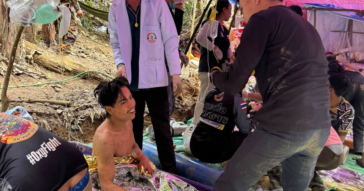 Rescuers free 4 men who had been trapped in a flooded Laos cave, search for 2 still missing