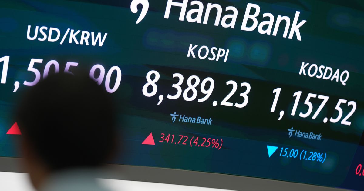 Asian shares are mostly higher, tracking Wall Street’s fresh records, and oil prices fall