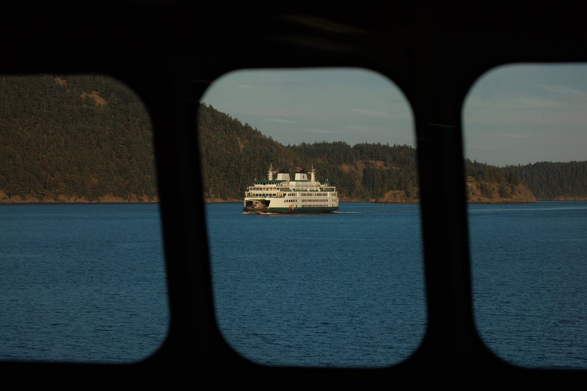 Ferries travel through the San Juan Islands at sunset last spring. (Erika Schultz / The Seattle Times, 2025)