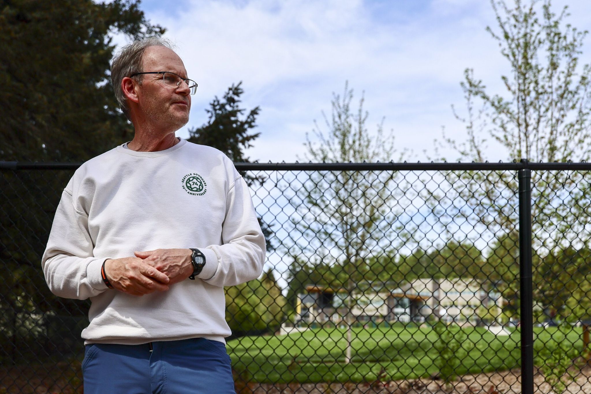 Brian Schmetzer visits the John Rogers Elementary school field in northeast Seattle where he played as a child. (Kevin Clark / The Seattle Times)