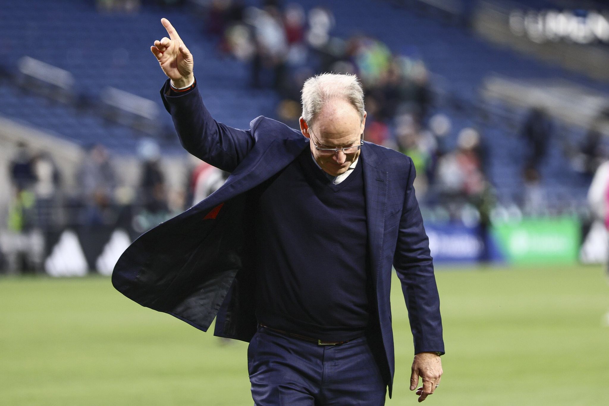 Brian Schmetzer, who grew from a Lake City Hawks soccer standout into the head coach of the Sounders FC, leaves the pitch May 13 after the Sounders defeated the San Jose Earthquakes, 3-2. A key to success, he says, is “Northwest grit.” (Kevin Clark / The Seattle Times)