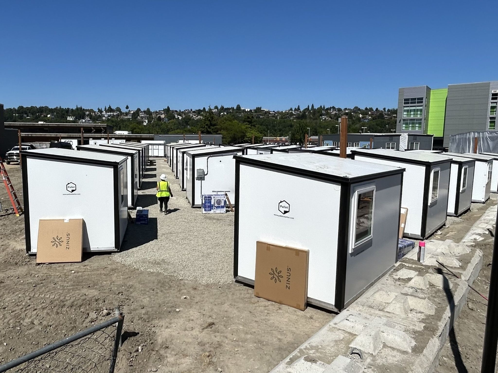 Pallet Shelter, based in Everett, built 75 tiny houses that are being set up in Seattle’s Interbay neighborhood. Total cost, with shower trailers and site work: $3.5 million. (Danny Westneat / The Seattle Times)