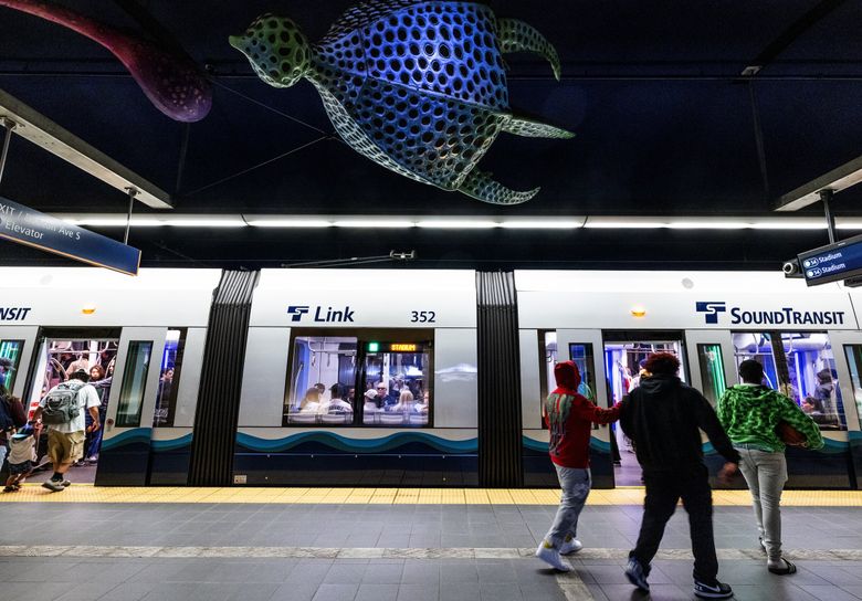 Dan Corson’s hanging sculptures called “Space Forms” float above, in Beacon Hill’s underground light rail station. (Ken Lambert / The Seattle Times)