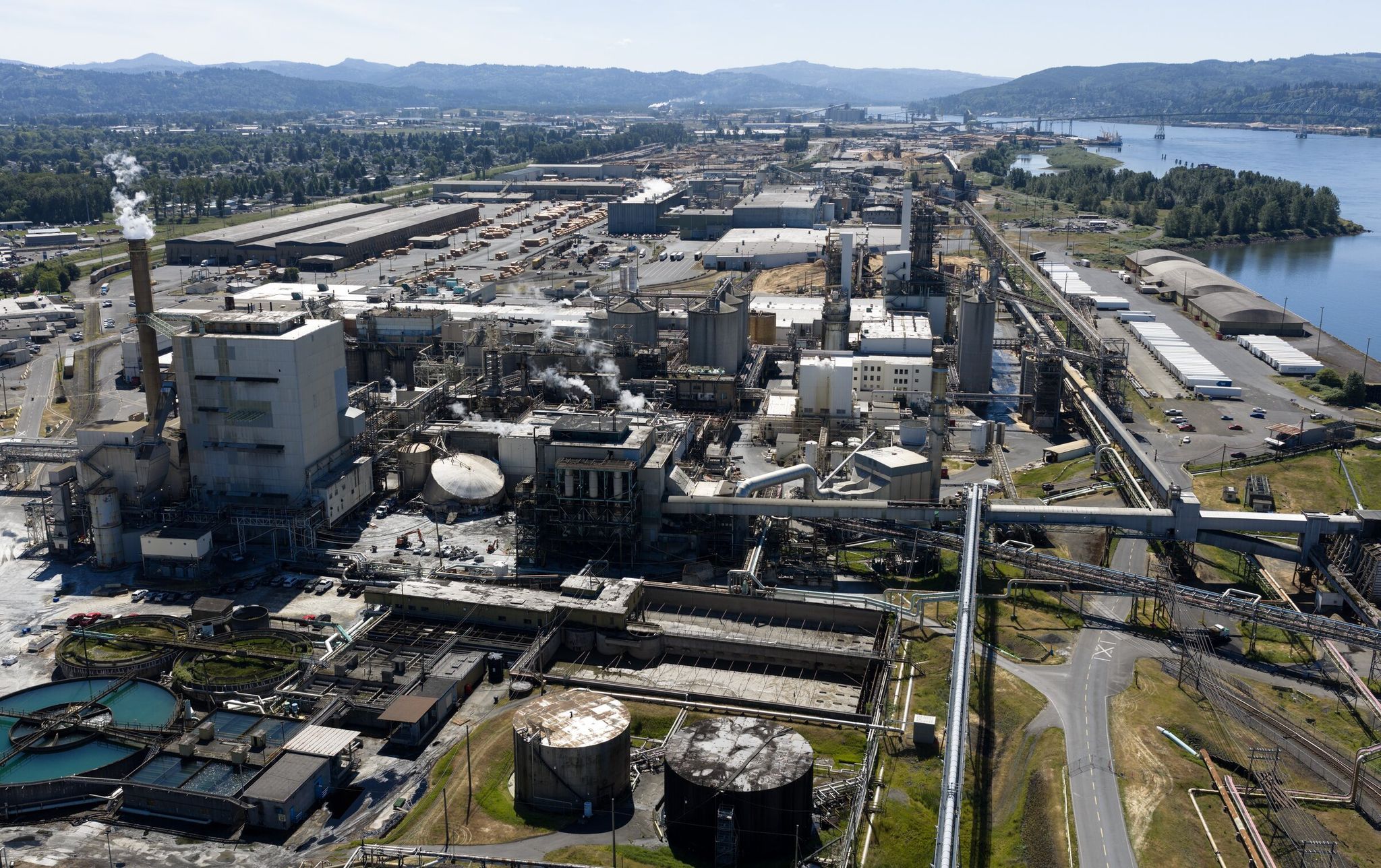 A damaged chemical tank sits at the Nippon Dynawave Packaging mill in Longview on Monday, June 1. An implosion on May 26 caused a spill of a highly caustic chemical, killing 11 workers at the pulp and paper mill. (Nick Wagner / The Seattle Times)