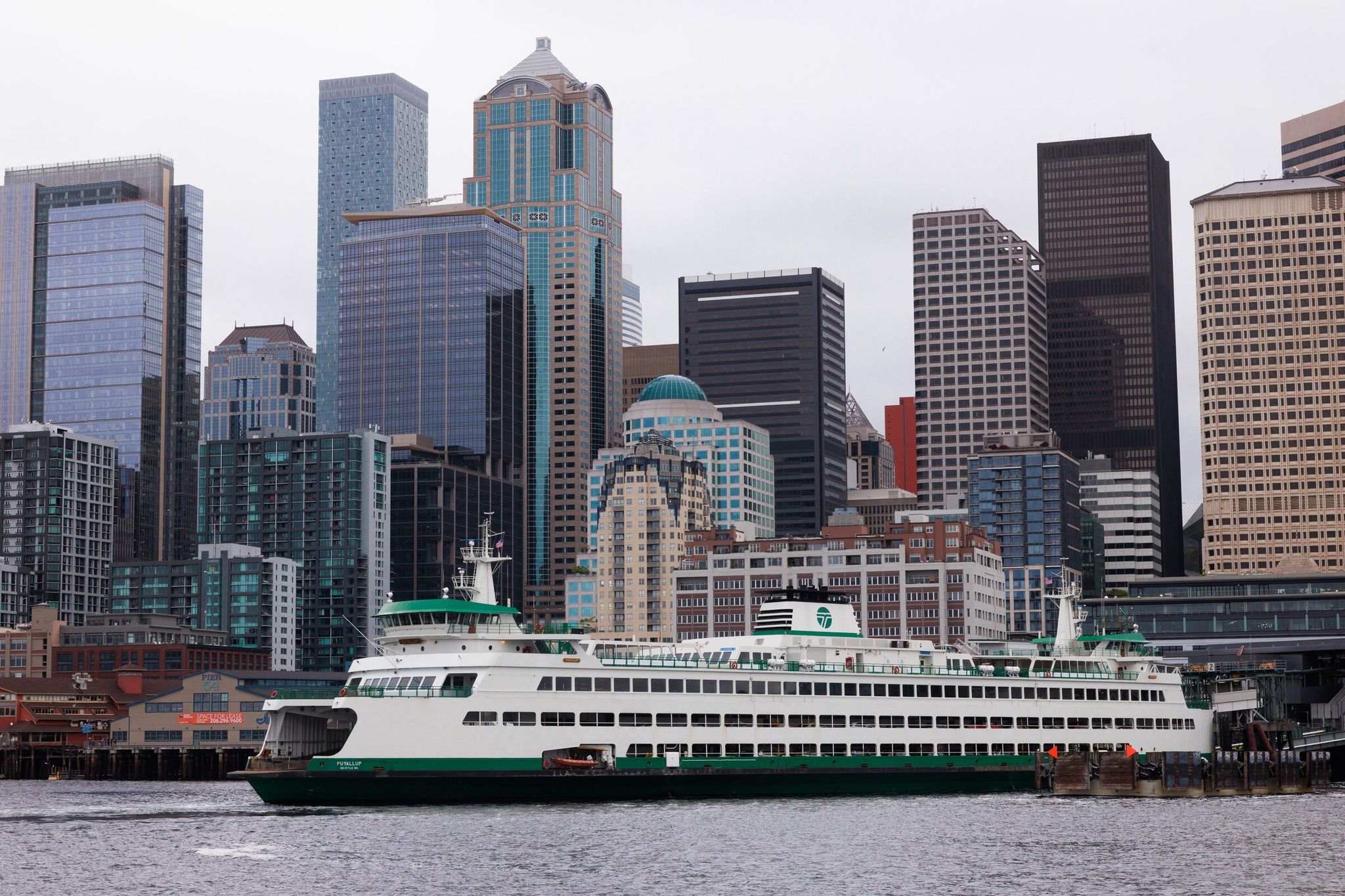 A ferry docks at a Seattle terminal, at Pier 52 on the downtown waterfront, in April 2025. (Erika Schultz / The Seattle Times)