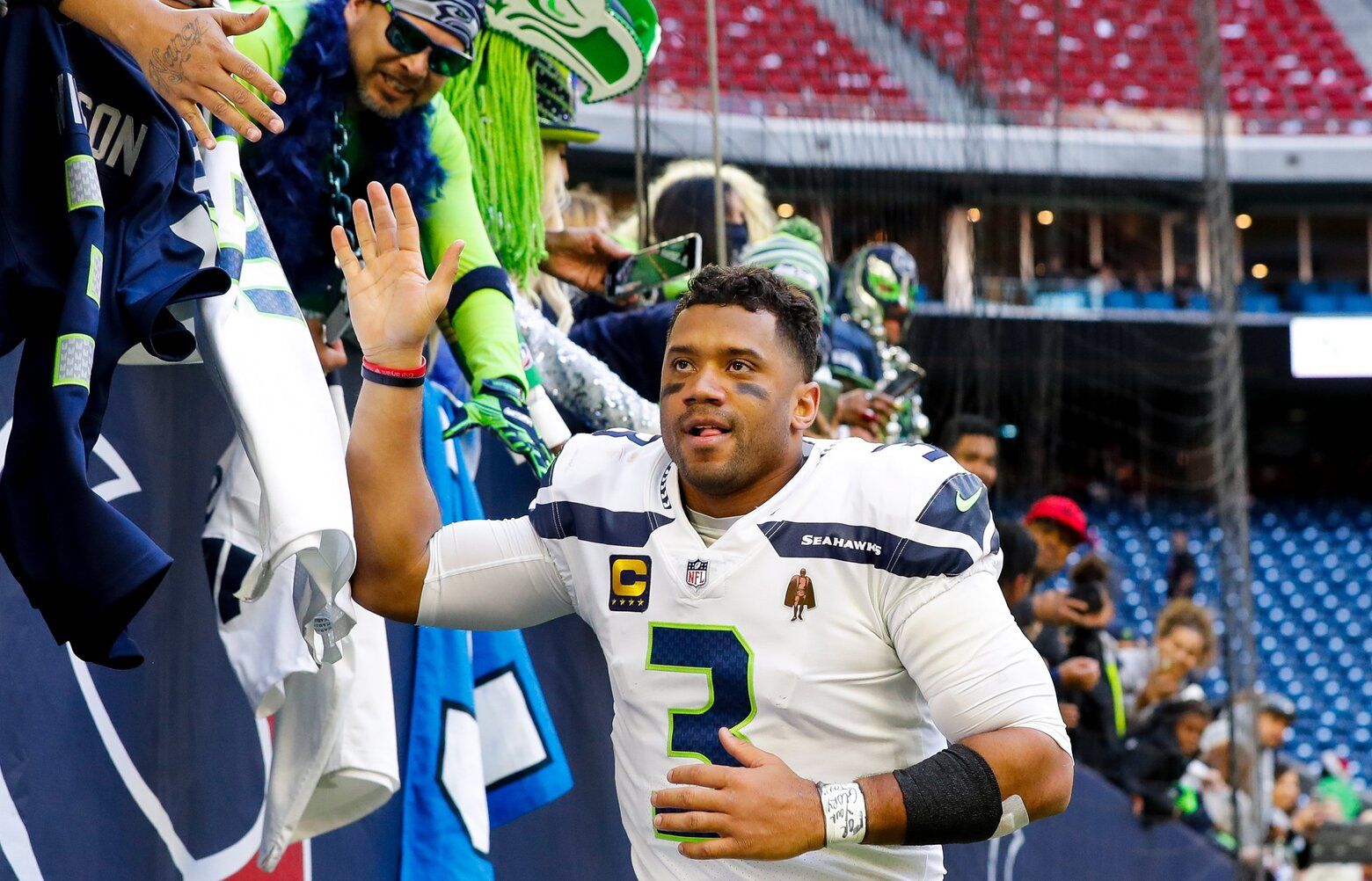 NRG Stadium – Seattle Seahawks at Houston Texans – 121221
Seattle Seahawks quarterback Russell Wilson high-fives fans after a win against the Houston Texans Sunday, Dec. 12, 2021, in Houston. 219058