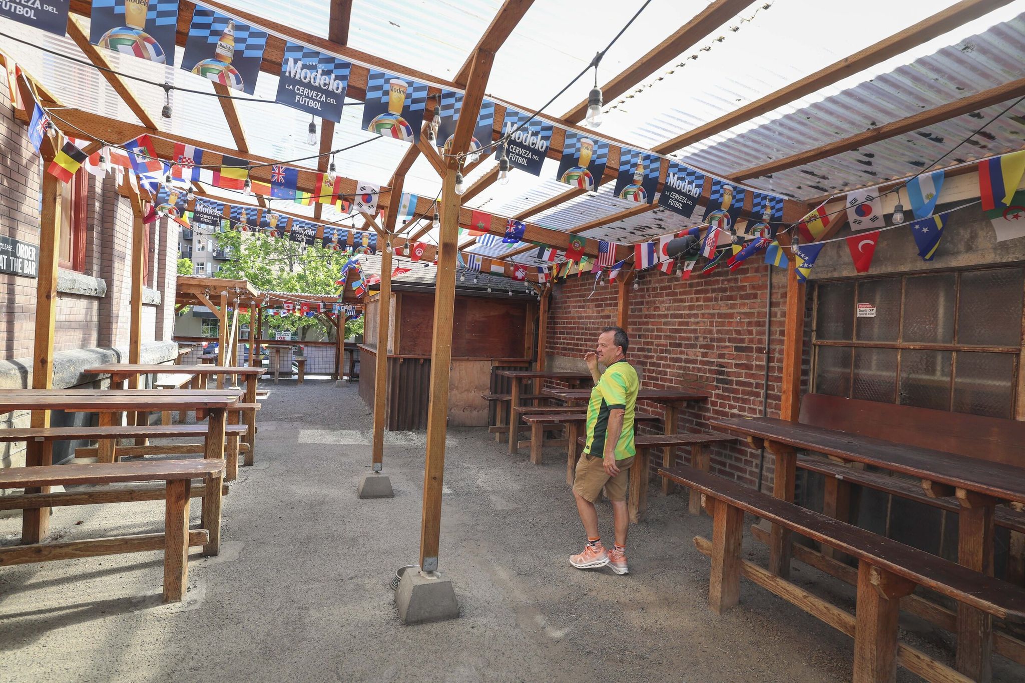 Owner Bradley Howe shows the open space that he expects to fill during World Cup viewing parties at Kangaroo & Kiwi. (Ivy Ceballo / The Seattle Times)