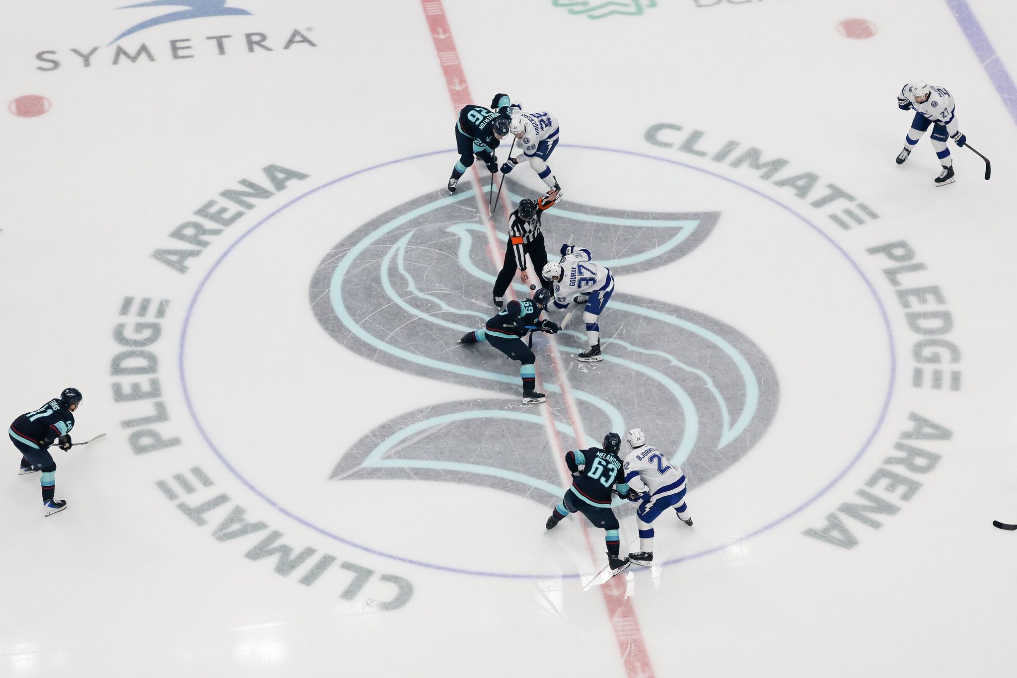 Kraken center Ben Meyers takes the opening face-off against Lightning center Yanni Gourde during the first period of a game in March. (Jennifer Buchanan / The Seattle Times)