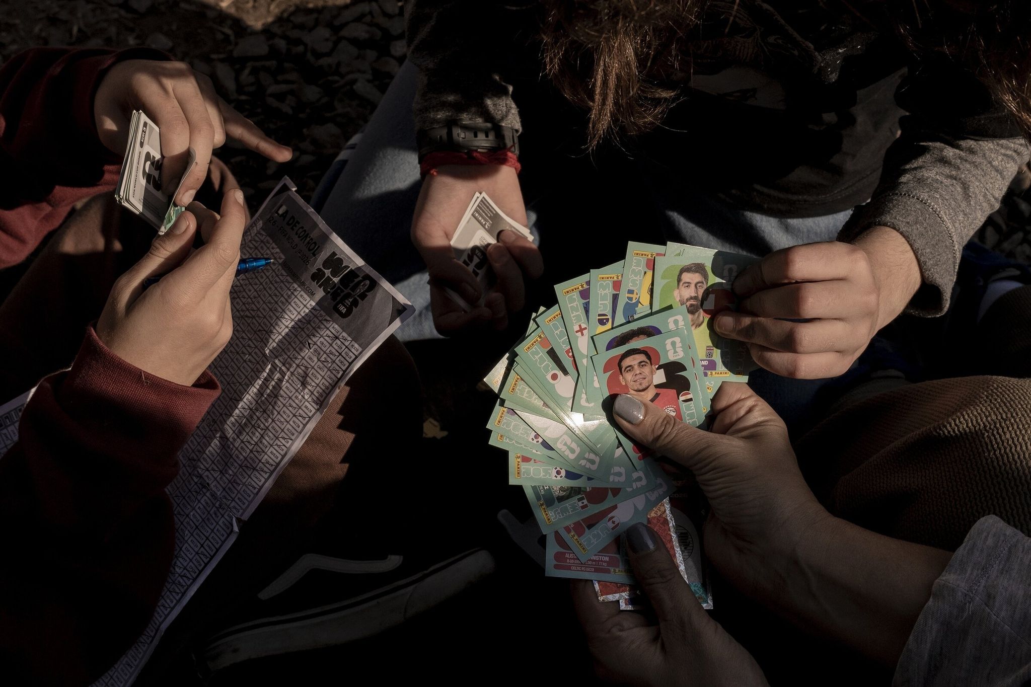 Last month people traded World Cup stickers in Buenos Aires, Argentina. World Cup sticker albums mesmerized children and adults in Argentina — the collecting craze seems immune to the digital revolution. (Anita Puchar Serra / The New York Times)