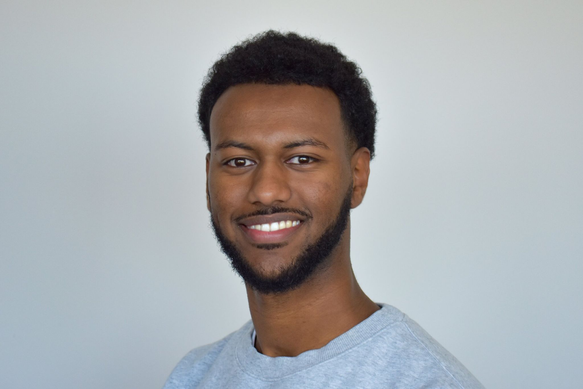 Samray Estifanos, a graphic designer from Maple Valley, is one of the winners of the Juneteenth Matchday design contest organized by SeattleFWC26. (Provided by Samray Estifanos)