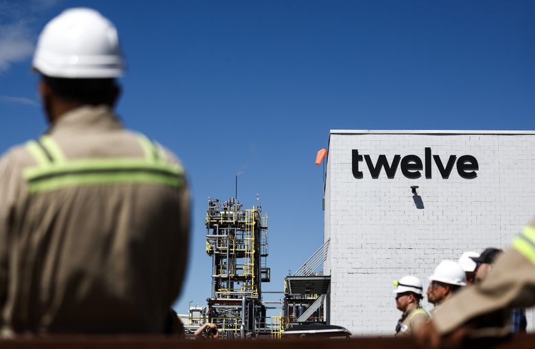 Twelve plant employees listen to a presentation during a ribbon-cutting ceremony Wednesday. (Nick Wagner / The Seattle Times)