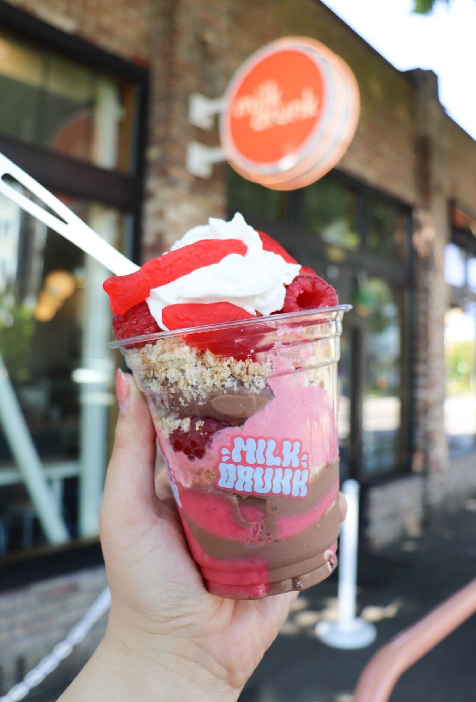 Milk Drunk’s raspberry-chocolate Swede Tooth features chocolate-espresso and raspberry swirls, berries, berry mousse and a cardamom crumble, topped with whipped cream and Swedish Fish candy. (Lauren Fratzke)