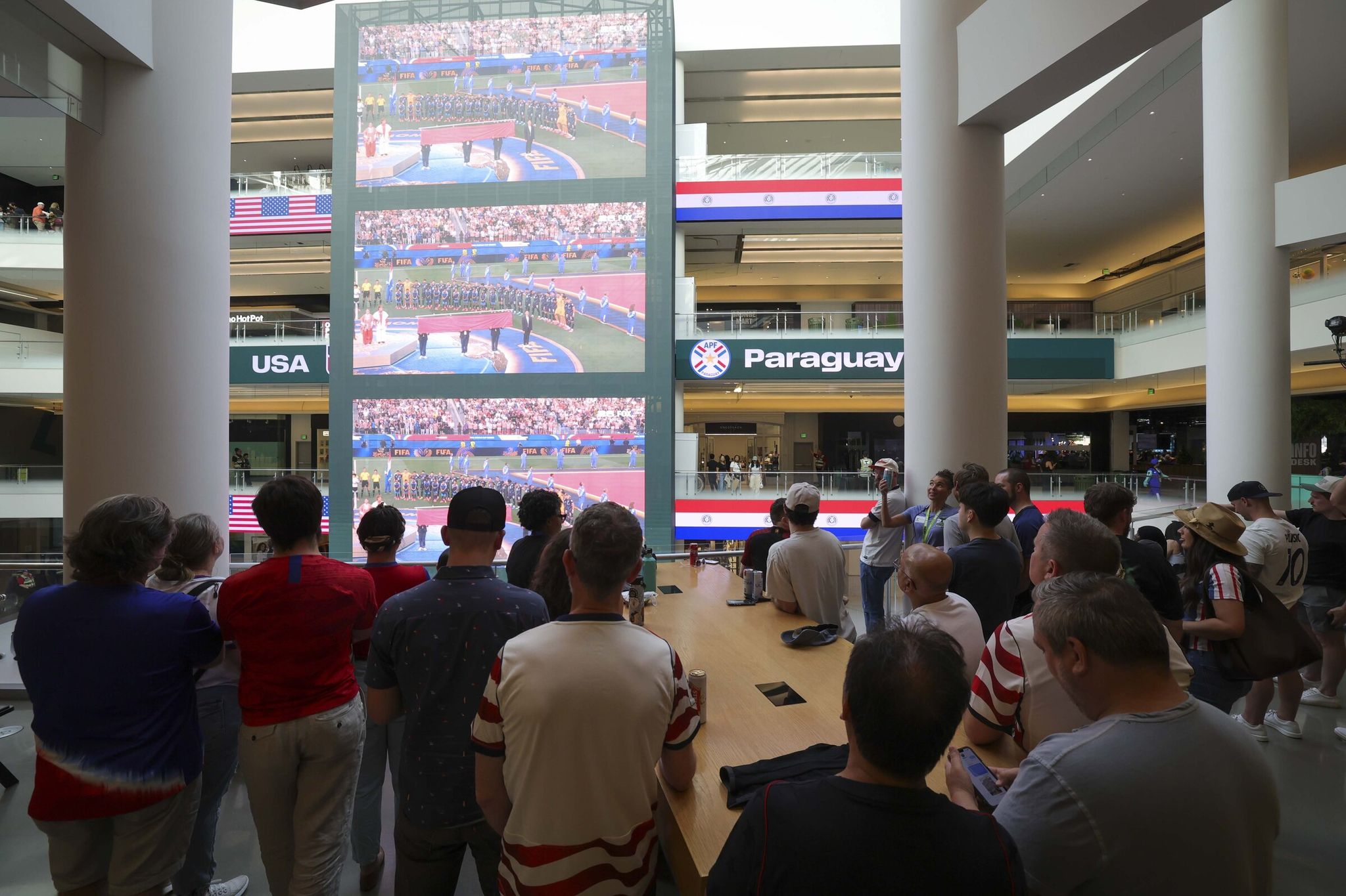 Soccer fans watch the U.S. men's team take on Paraguay in the opening match for each country at the FIFA World Cup 2026 in Seattle Soccer House, also known as Pacific Place, on June 12. (Ivy Ceballo / The Seattle Times)