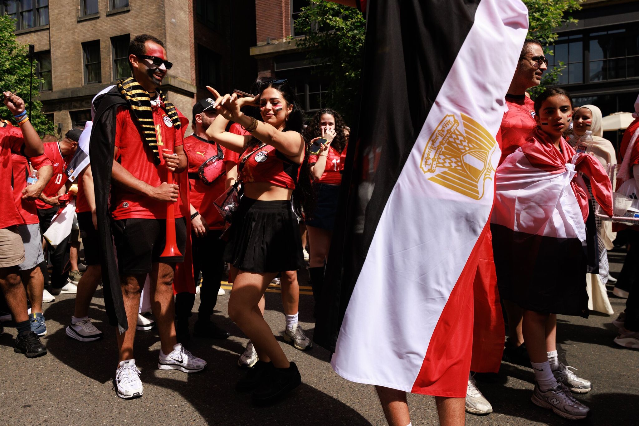 Egypt fans, including Lina Omar, center, gather for the Belgium-Egypt World Cup match near Lumen Field, known as Seattle Stadium for the World Cup, in Seattle on Monday. (Erika Schultz / The Seattle Times)