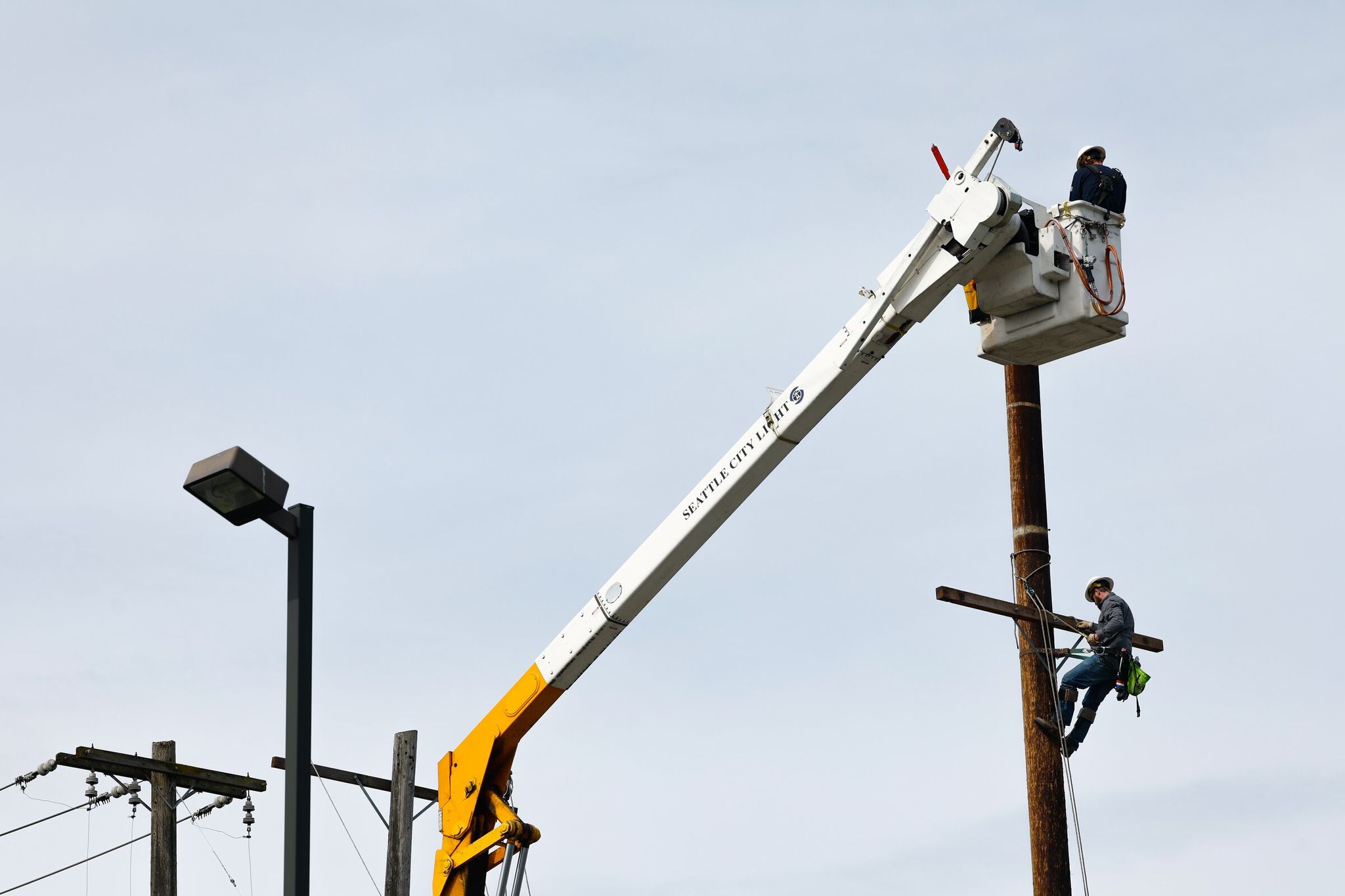 Lineworkers at the South Service Center for Seattle City Light. By 2045, Seattle City Light estimates the city will need more than twice the electricity it uses today. (Karen Ducey / The Seattle Times, 2025)