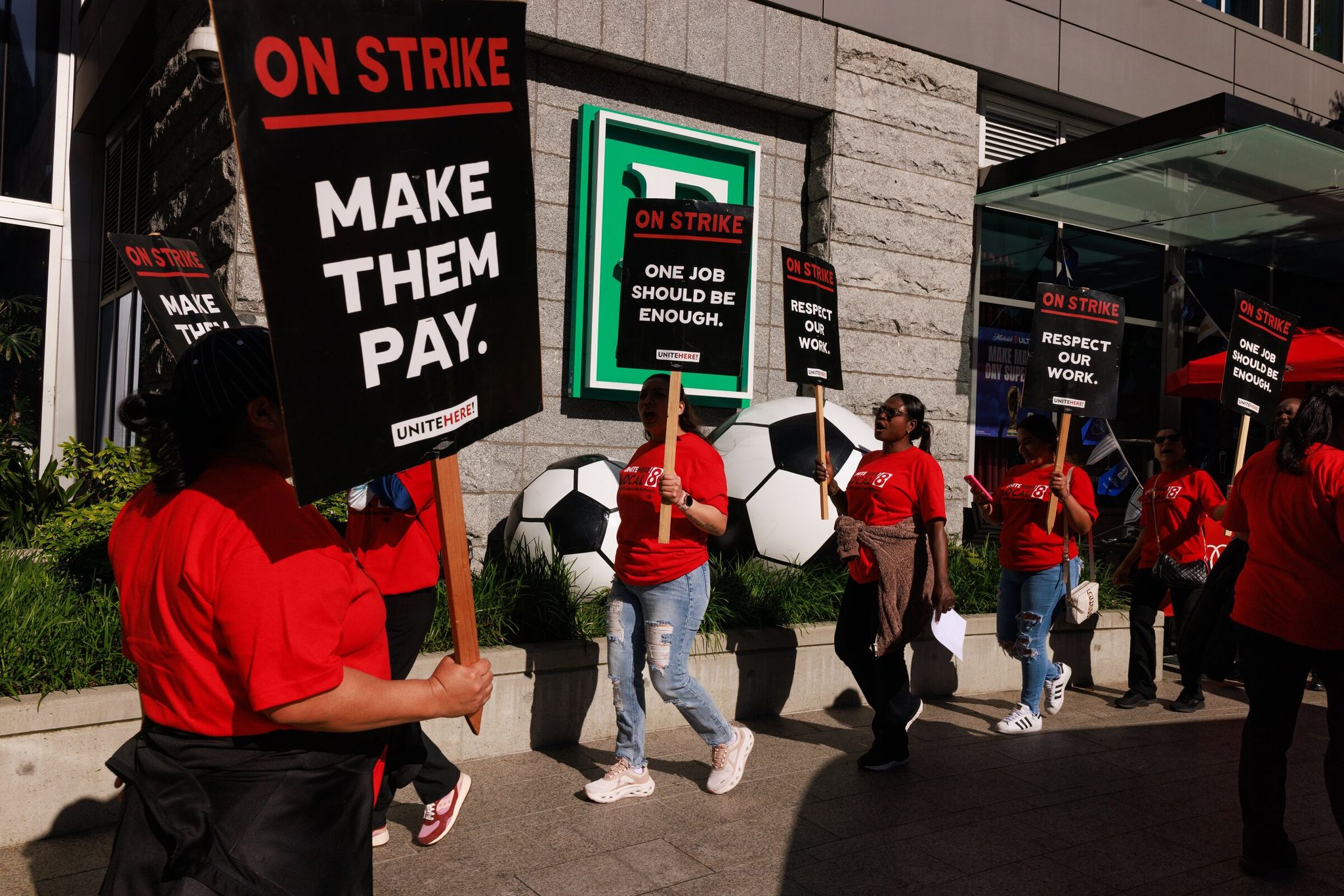 Union hotel workers, part of Unite Here! Local 8, march outside Embassy Suites by Hilton Seattle Downtown Pioneer Square in Seattle on Thursday, June 18, 2026. (Erika Schultz / The Seattle Times)