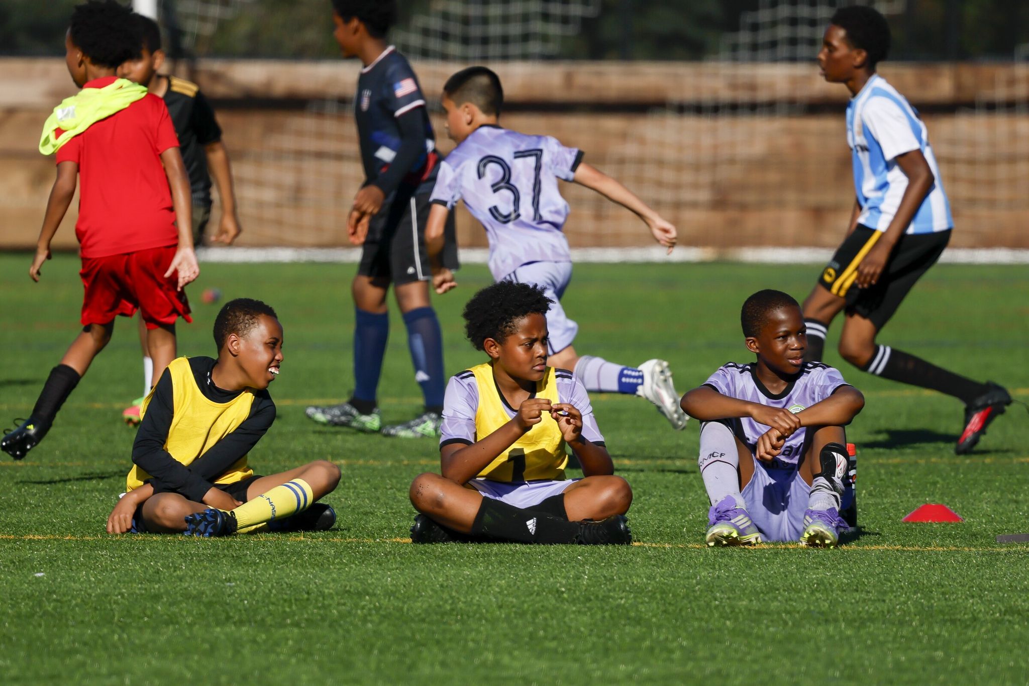 Players wait for their turn to take the field during a 3-on-3 soccer tournament in Seattle (SeaTac). (Jennifer Buchanan / The Seattle Times)