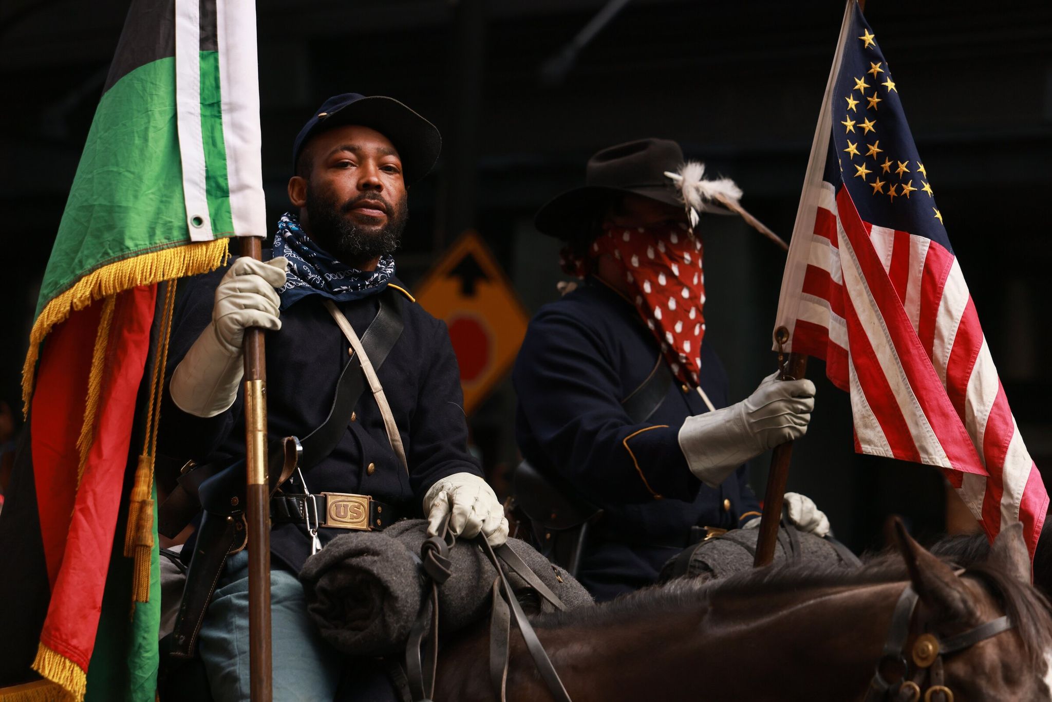 Buffalo soldiers march toward the U.S. vs. Australia match in Seattle for Juneteenth. (Erika Schultz / The Seattle Times)