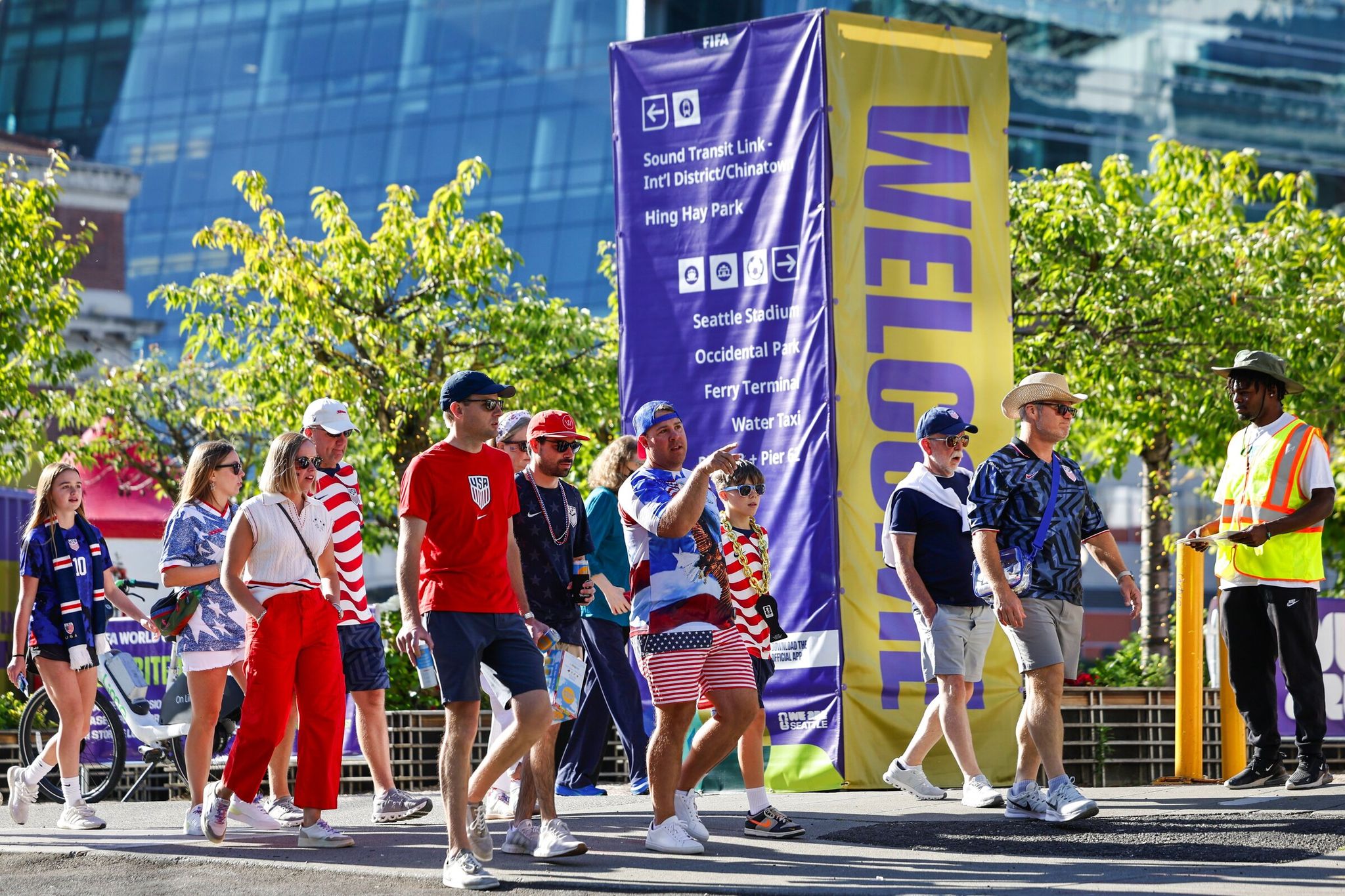 Soccer fans make their way through Pioneer Square, seen at South Jackson Street and Third Avenue South, as they head to Seattle Stadium prior to the United States vs. Australia World Cup match in Seattle on Friday. (Karen Ducey / The Seattle Times)