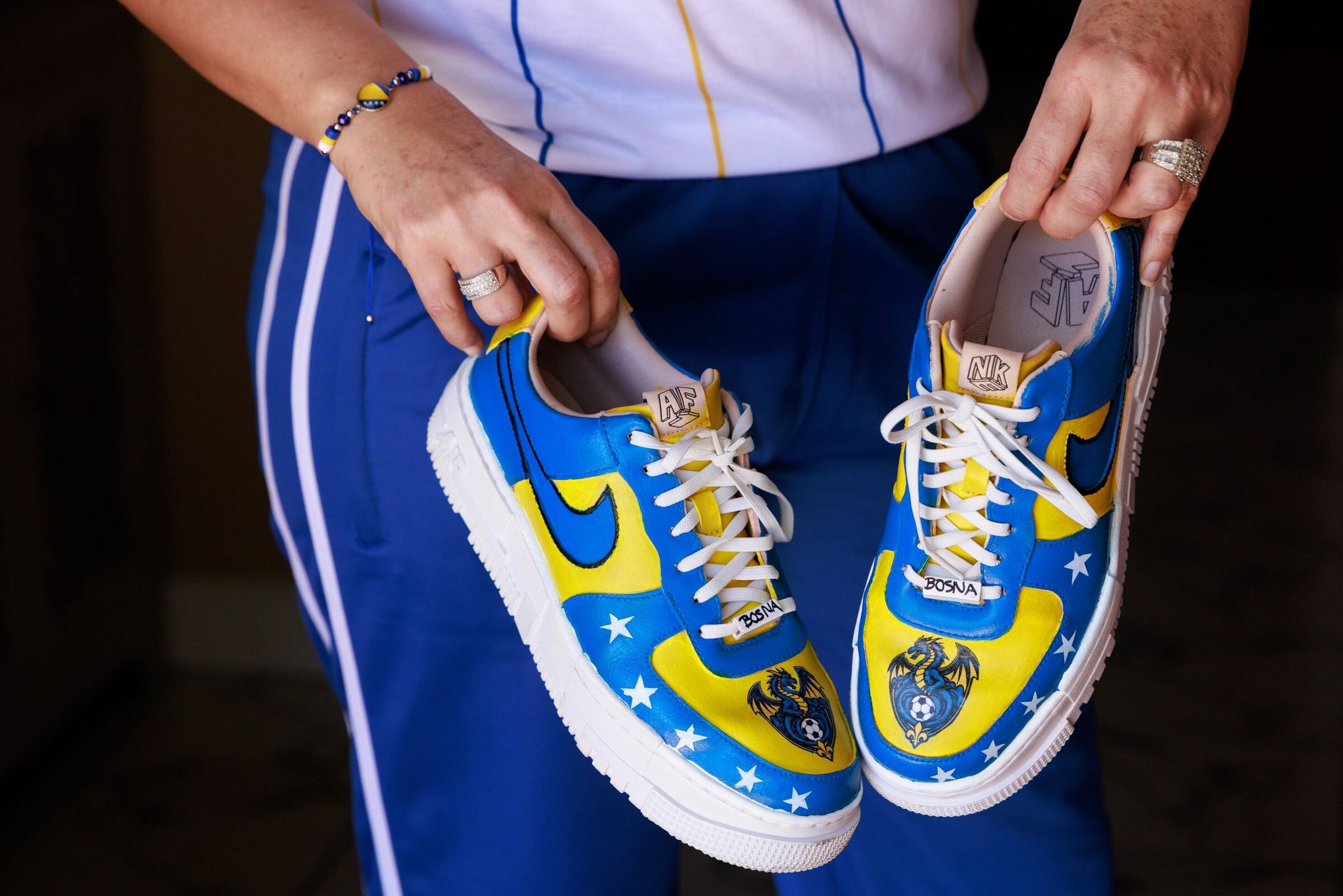Elvira Vojinovich manually decorated her sneakers in support of the Bosnia and Herzegovina national team at the FIFA World Cup. (Erika Schulz / The Seattle Times)