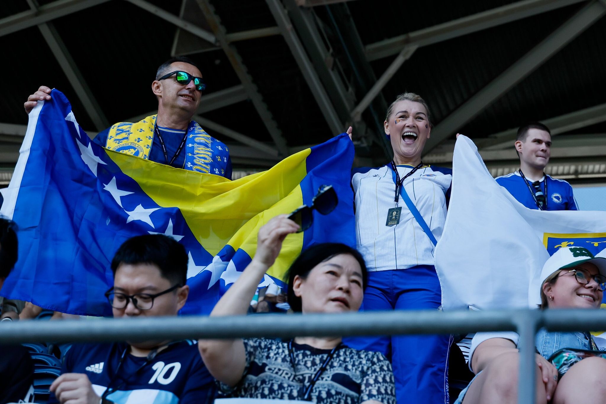 Amir and Elvira Vojinovich cheer as the Bosnia and Herzegovina players take the field before the match against Qatar. (Jennifer Buchanan / The Seattle Times)