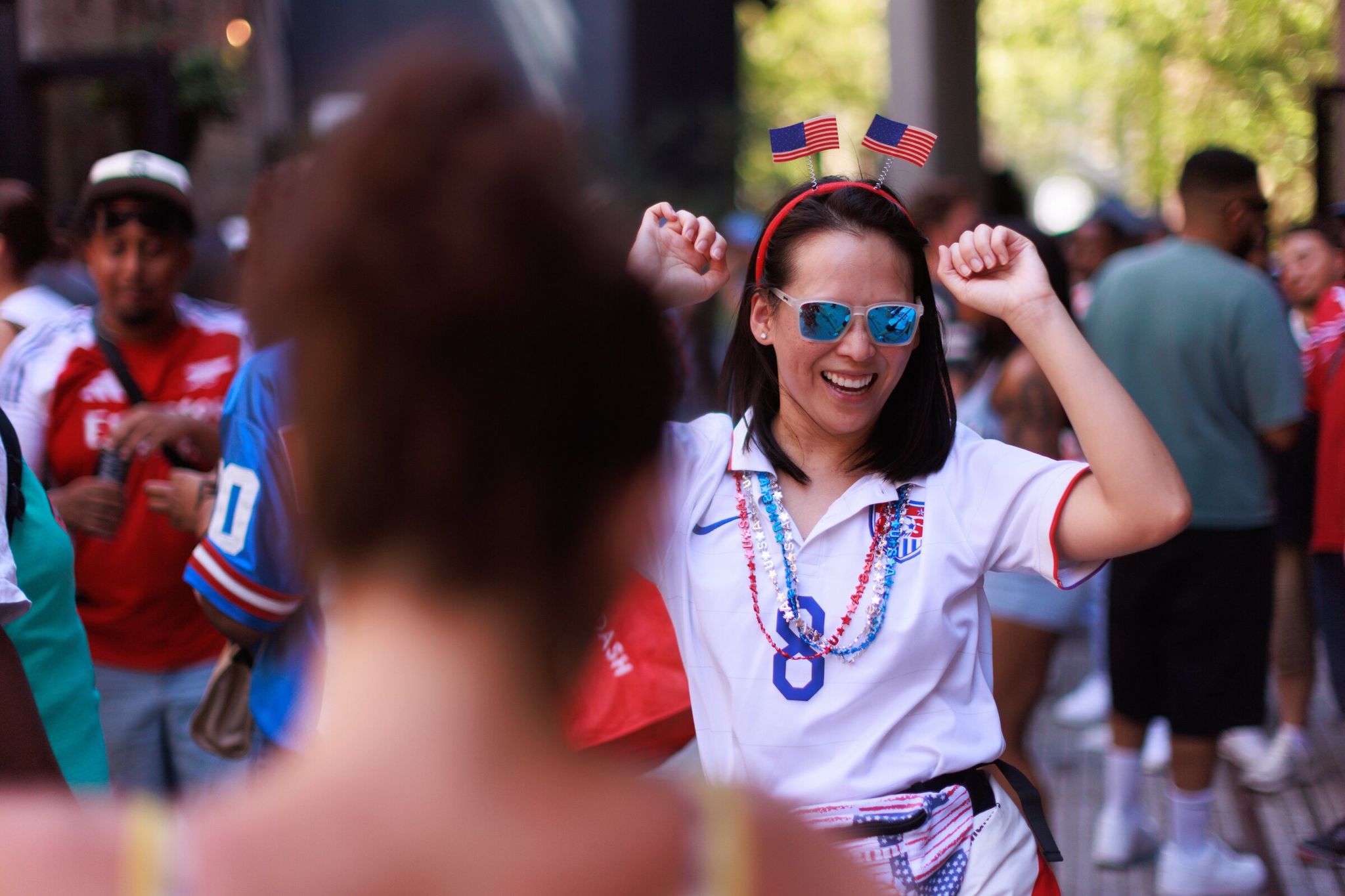 At Lil Lowlander in Seattle, Jennifer Tang celebrates the U.S.’s win over Australia on June 19. The temporary bar is a spinoff of Lowlander Brewing operating during World Cup season. (Erika Schultz / The Seattle Times)