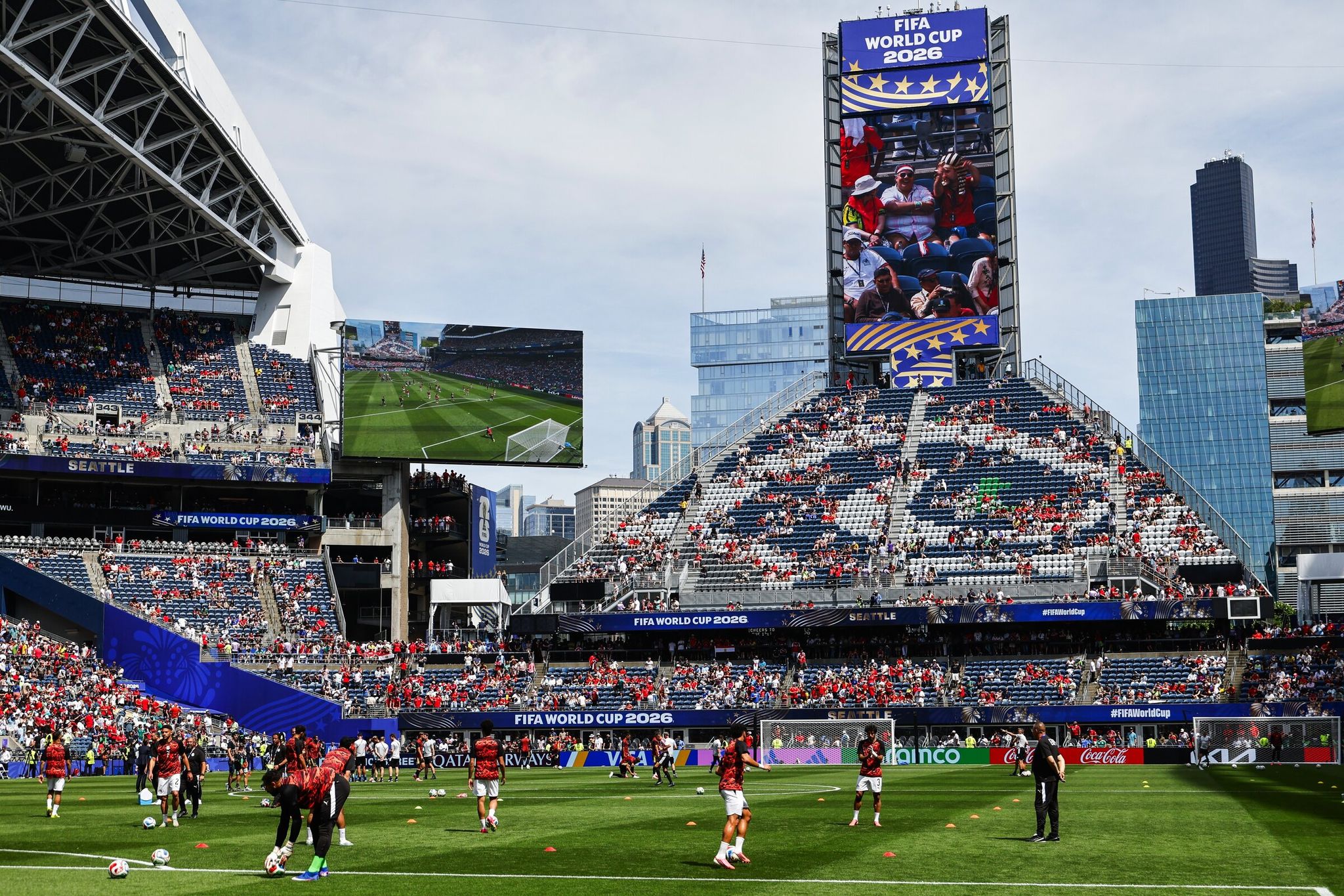 Belgium and Egypt national team players warm up on June 15 as fans gradually arrive for the first World Cup match at Seattle’s stadium, also known as Lumen Field. The match ended in a 1-1 draw. (Dean Rutz / The Seattle Times)