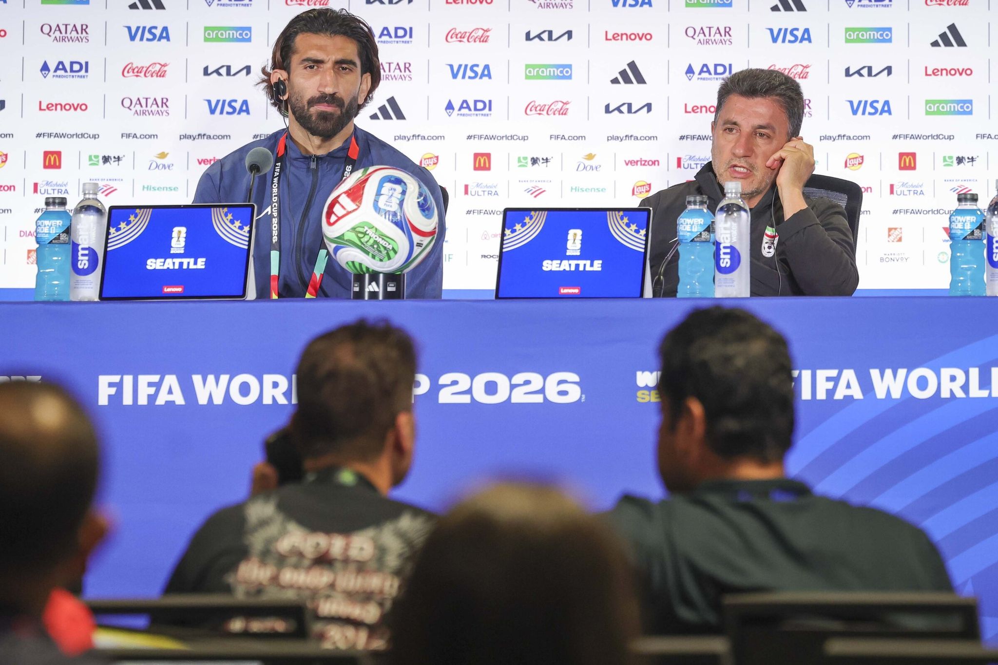 Iran coach Amir Ghalenoei, right, speaks during a news conference Thursday as goalkeeper Alireza Beiranvand looks on before their FIFA Men’s World Cup match against Egypt at Seattle Stadium.  (Ivy Ceballo / The Seattle Times)