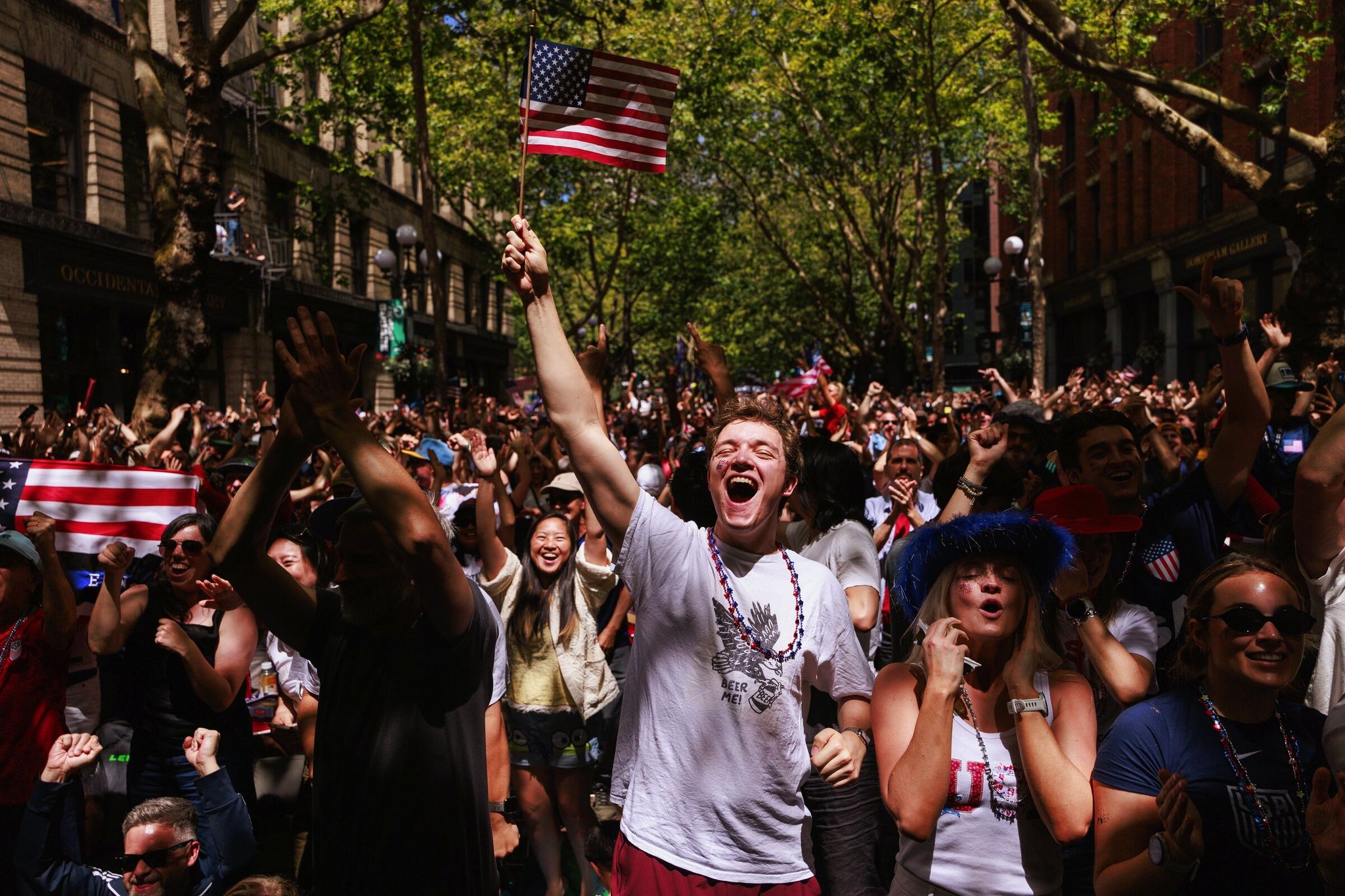 Daniel Krauss, of Texas, and Hayleigh Young, of Maryland, celebrate the United States’ second goal June 19 against Australia at Occidental Park in downtown Seattle. (Erika Schultz / The Seattle Times)