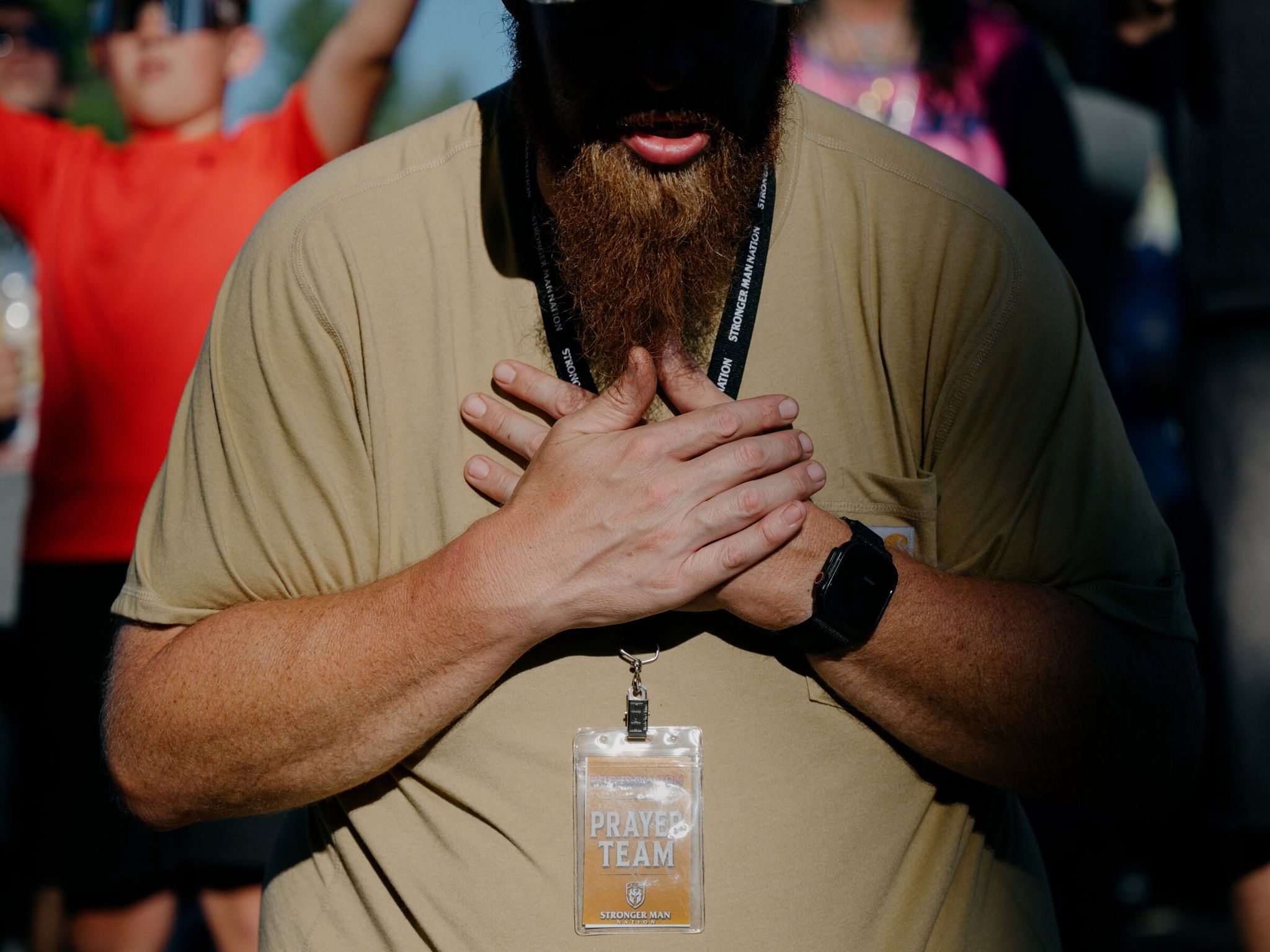 Men pray and listen during a performance on June 20 by two worship groups that joined together at Freedom Con, held over Father’s Day weekend at the Gorge Amphitheatre grounds. (Grant Hindsley / The New York Times)