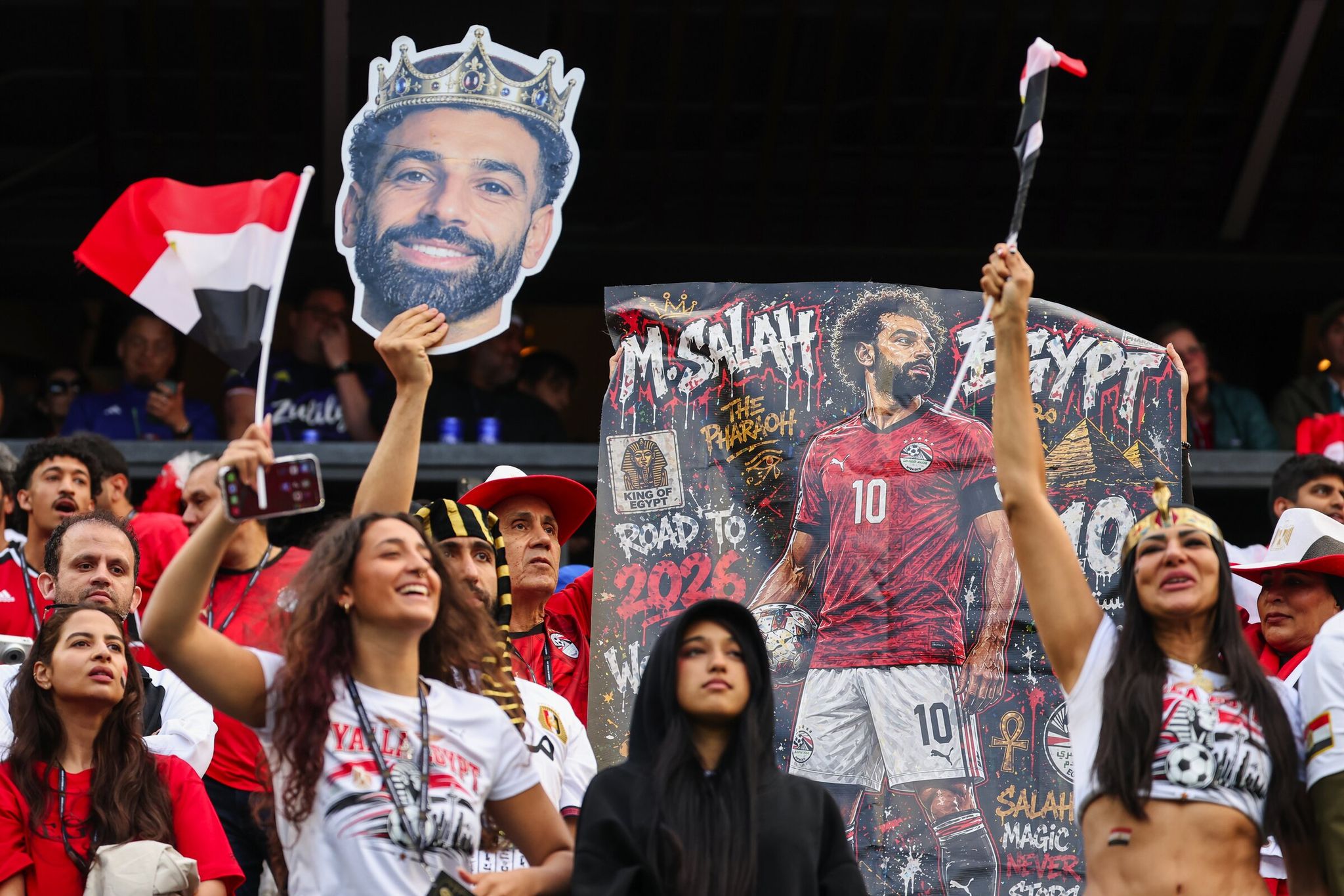 Egypt fans get excited about seeing Egypt go ahead: Mohamed “Mo” Salah celebrates from the stands before the FIFA World Cup group stage match against Iran on Friday at Seattle Stadium. (Dean Rutz / The Seattle Times)