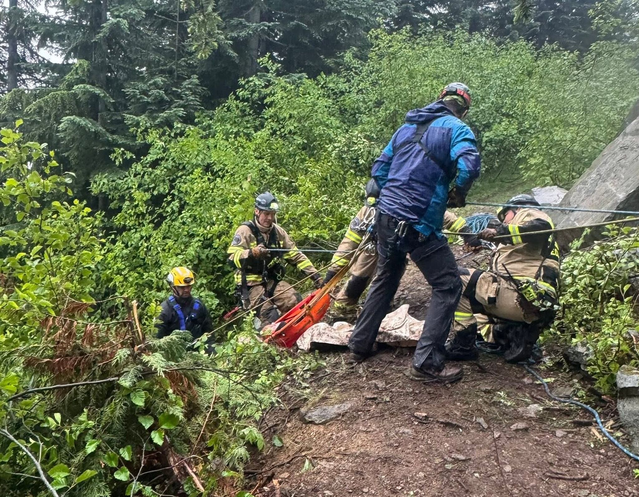 Rescuers pulled two men off a cliff after the vehicle they were in crashed in an area 12 miles up in the mountains above Wilkeson, near T-Rex Falls. (Pierce County Sheriff’s Office)