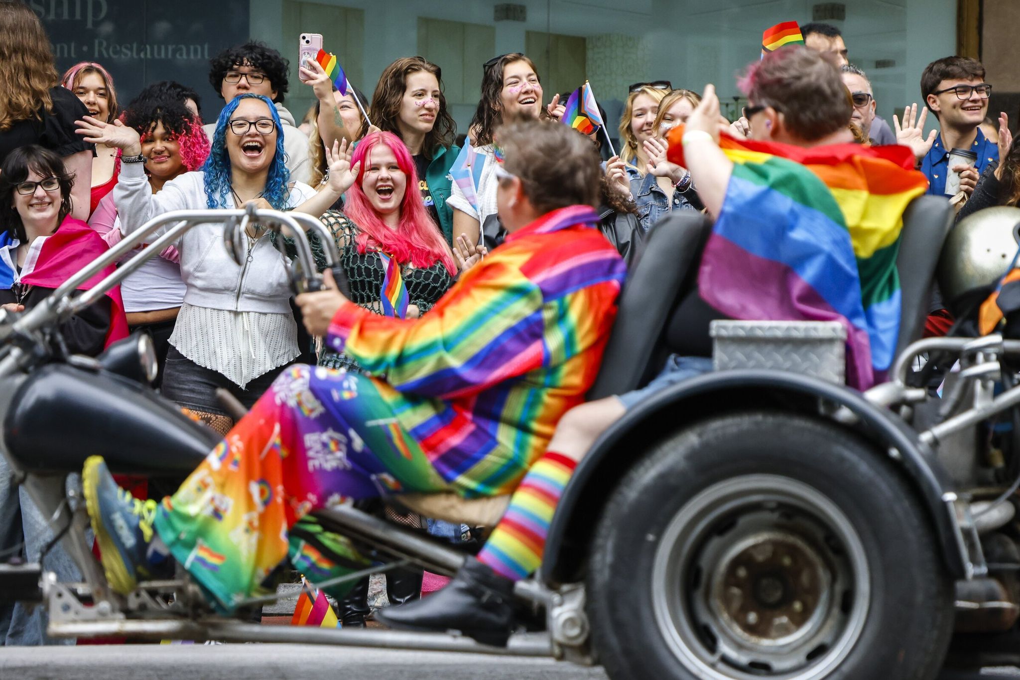 Spectators cheer “Dykes on Bikes” as they kick off the annual Pride Parade in downtown Seattle on Sunday. (Andrew Burke-Stevenson / The Seattle Times)
